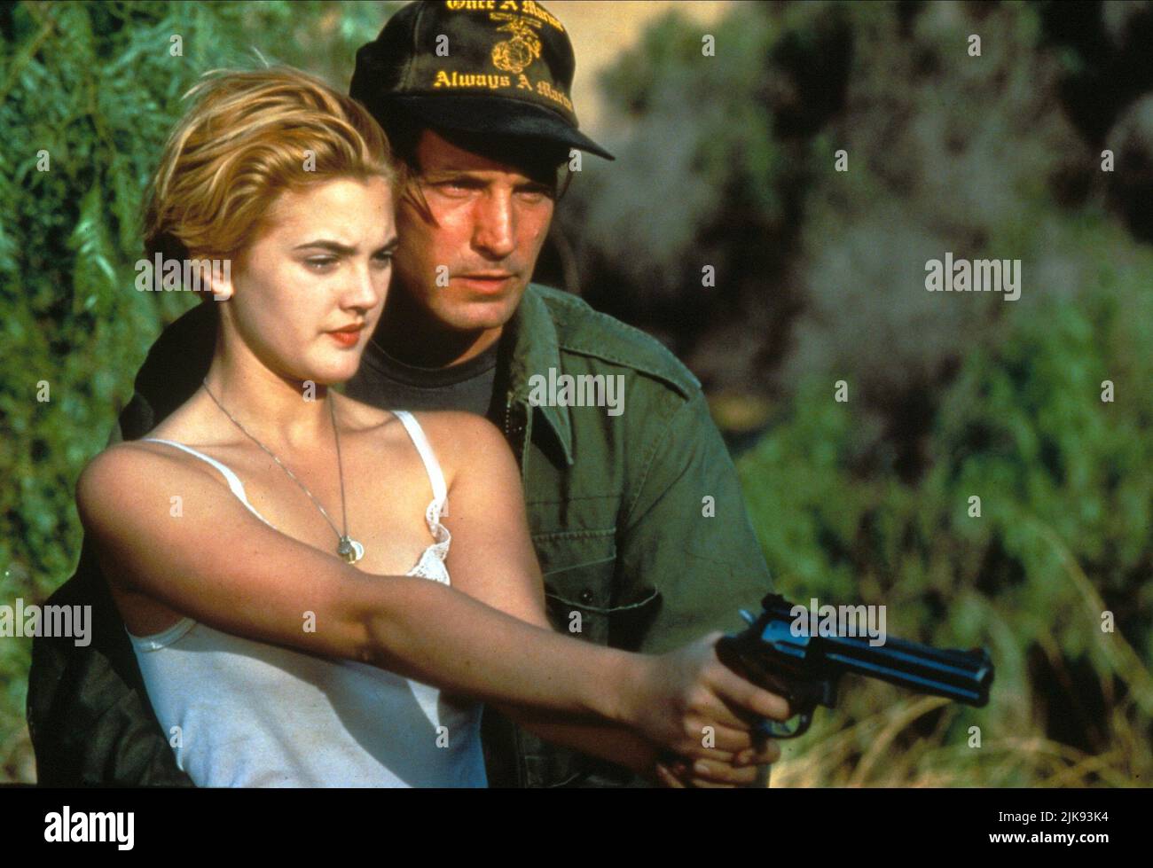 Drew Barrymore & Joe Dallesandro Film: Guncrazy (1992) Characters: Anita Minteer, Rooney  Director: Tamra Davis 11 September 1992   **WARNING** This Photograph is for editorial use only and is the copyright of ZETA ENTERTAINMENT and/or the Photographer assigned by the Film or Production Company and can only be reproduced by publications in conjunction with the promotion of the above Film. A Mandatory Credit To ZETA ENTERTAINMENT is required. The Photographer should also be credited when known. No commercial use can be granted without written authority from the Film Company. Stock Photo
