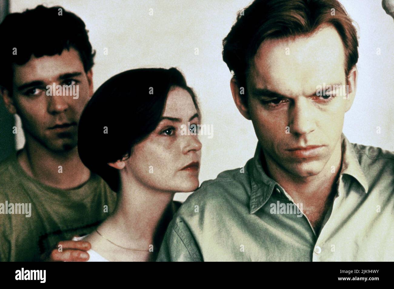 Russell Crowe, Genevieve Picot & Hugo Weaving Film: Proof (AUS 1991) Characters: Andy,Celia (as Genevieve Picot) & Martin  Director: Jocelyn Moorhouse 15 August 1991   **WARNING** This Photograph is for editorial use only and is the copyright of FINE LINE FEATURES and/or the Photographer assigned by the Film or Production Company and can only be reproduced by publications in conjunction with the promotion of the above Film. A Mandatory Credit To FINE LINE FEATURES is required. The Photographer should also be credited when known. No commercial use can be granted without written authority from t Stock Photo