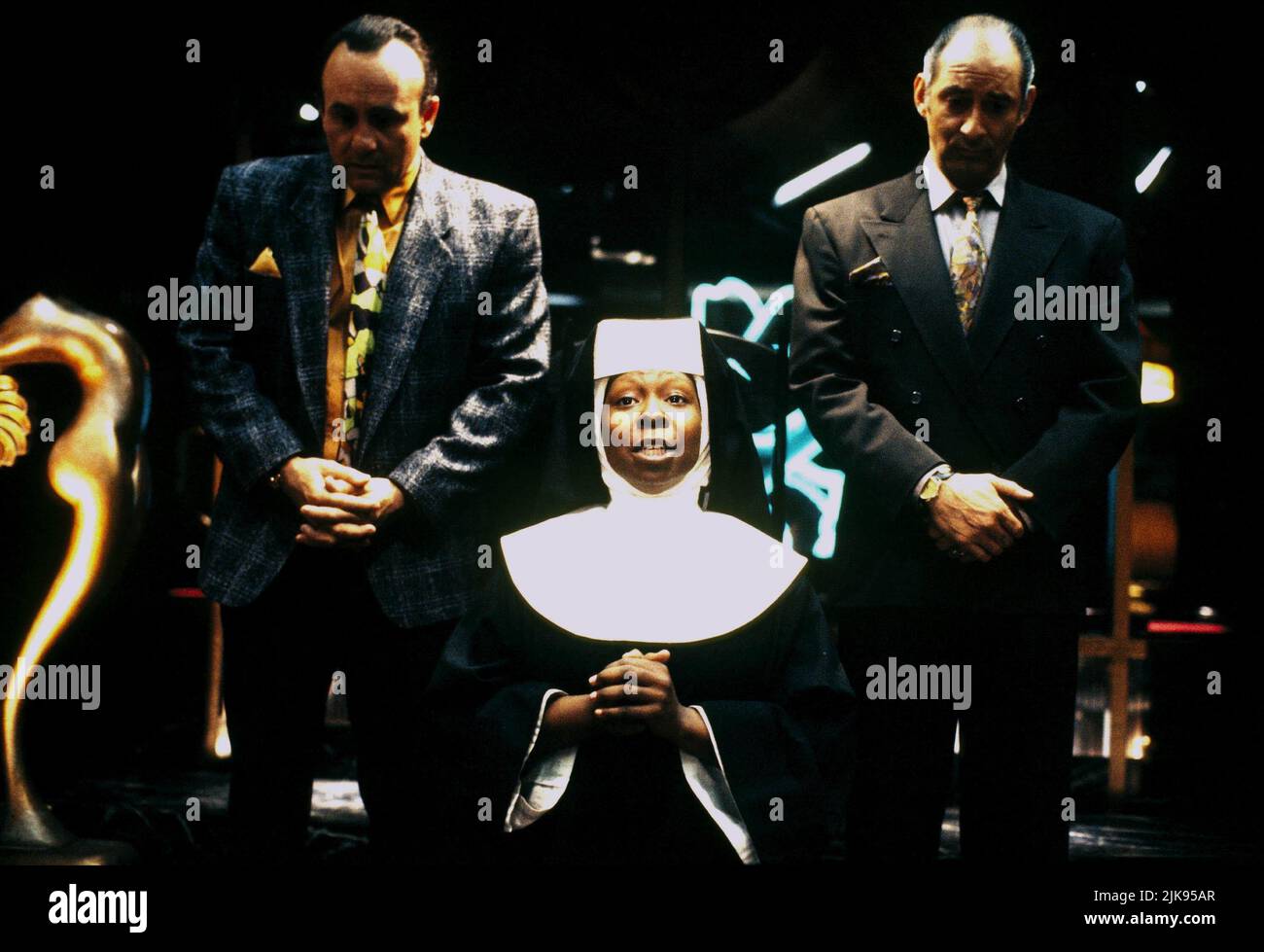 Robert Miranda, Whoopi Goldberg & Richard Portnow Film: Sister Act (USA 1992) Characters: Joey,Deloris Van Cartier & Willy  Director: Emile Ardolino 29 May 1992   **WARNING** This Photograph is for editorial use only and is the copyright of TOUCHSTONE and/or the Photographer assigned by the Film or Production Company and can only be reproduced by publications in conjunction with the promotion of the above Film. A Mandatory Credit To TOUCHSTONE is required. The Photographer should also be credited when known. No commercial use can be granted without written authority from the Film Company. Stock Photo