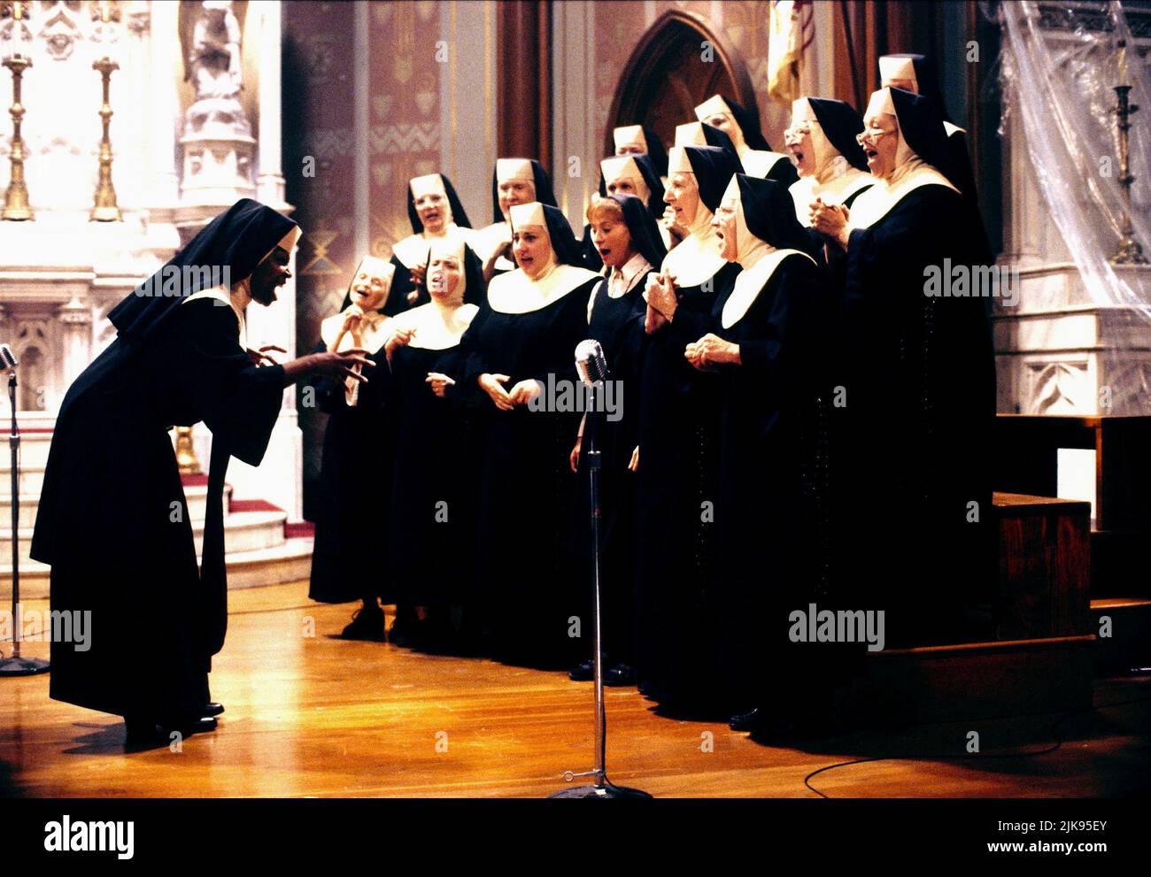Whoopi Goldberg Film: Sister Act (USA 1992) Characters: Deloris Van Cartier  Director: Emile Ardolino 29 May 1992   **WARNING** This Photograph is for editorial use only and is the copyright of TOUCHSTONE and/or the Photographer assigned by the Film or Production Company and can only be reproduced by publications in conjunction with the promotion of the above Film. A Mandatory Credit To TOUCHSTONE is required. The Photographer should also be credited when known. No commercial use can be granted without written authority from the Film Company. Stock Photo