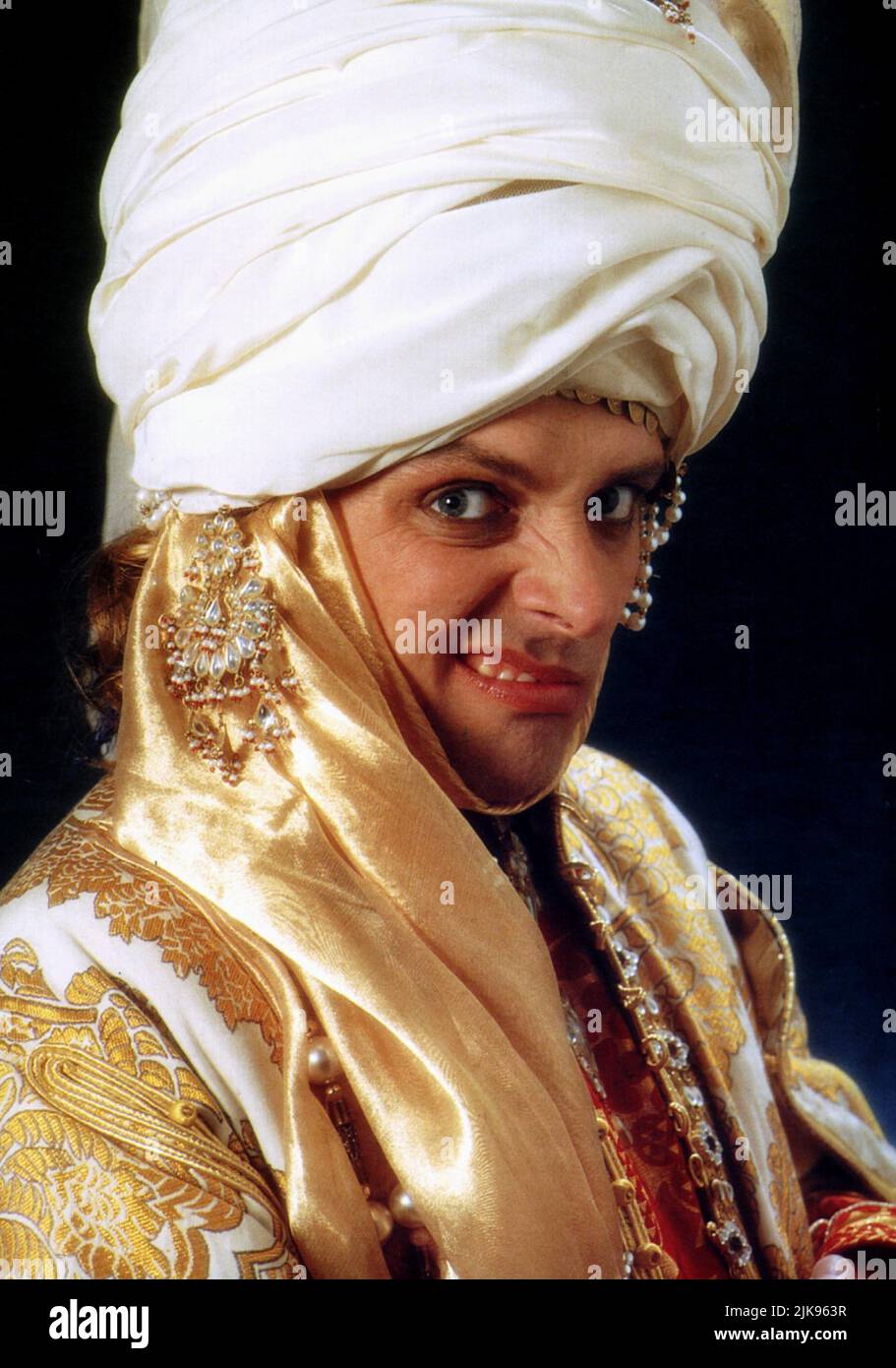 Rik Mayall Film: Carry On Columbus (UK 1982) Characters: The Sultan  Director: Gerald Thomas 02 October 1992   **WARNING** This Photograph is for editorial use only and is the copyright of COMEDY HOUSE and/or the Photographer assigned by the Film or Production Company and can only be reproduced by publications in conjunction with the promotion of the above Film. A Mandatory Credit To COMEDY HOUSE is required. The Photographer should also be credited when known. No commercial use can be granted without written authority from the Film Company. Stock Photo