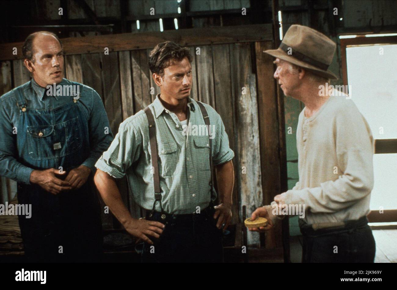 John Malkovich, Gary Sinise & Ray Walston Film: Of Mice And Men (1992) Characters: Lennie Small,,Candy  Director: Gary Sinise 16 September 1992   **WARNING** This Photograph is for editorial use only and is the copyright of MGM and/or the Photographer assigned by the Film or Production Company and can only be reproduced by publications in conjunction with the promotion of the above Film. A Mandatory Credit To MGM is required. The Photographer should also be credited when known. No commercial use can be granted without written authority from the Film Company. Stock Photo