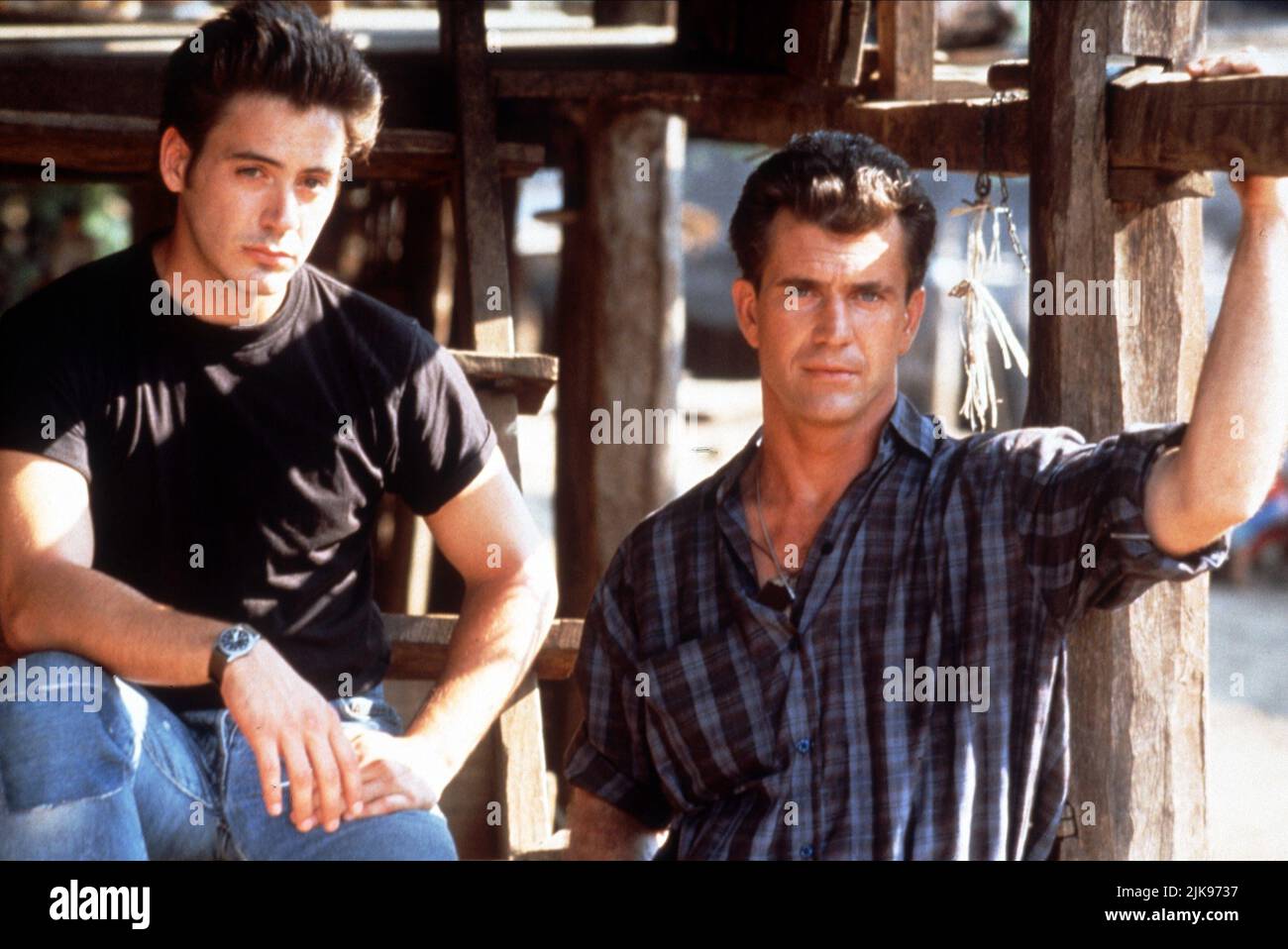 Robert Downey Jnr & Mel Gibson Film: Air America (1990) Characters: BILLY COVINGTON, Gene Ryack  Director: Roger Spottiswoode 10 August 1990   **WARNING** This Photograph is for editorial use only and is the copyright of TRISTAR and/or the Photographer assigned by the Film or Production Company and can only be reproduced by publications in conjunction with the promotion of the above Film. A Mandatory Credit To TRISTAR is required. The Photographer should also be credited when known. No commercial use can be granted without written authority from the Film Company. Stock Photo