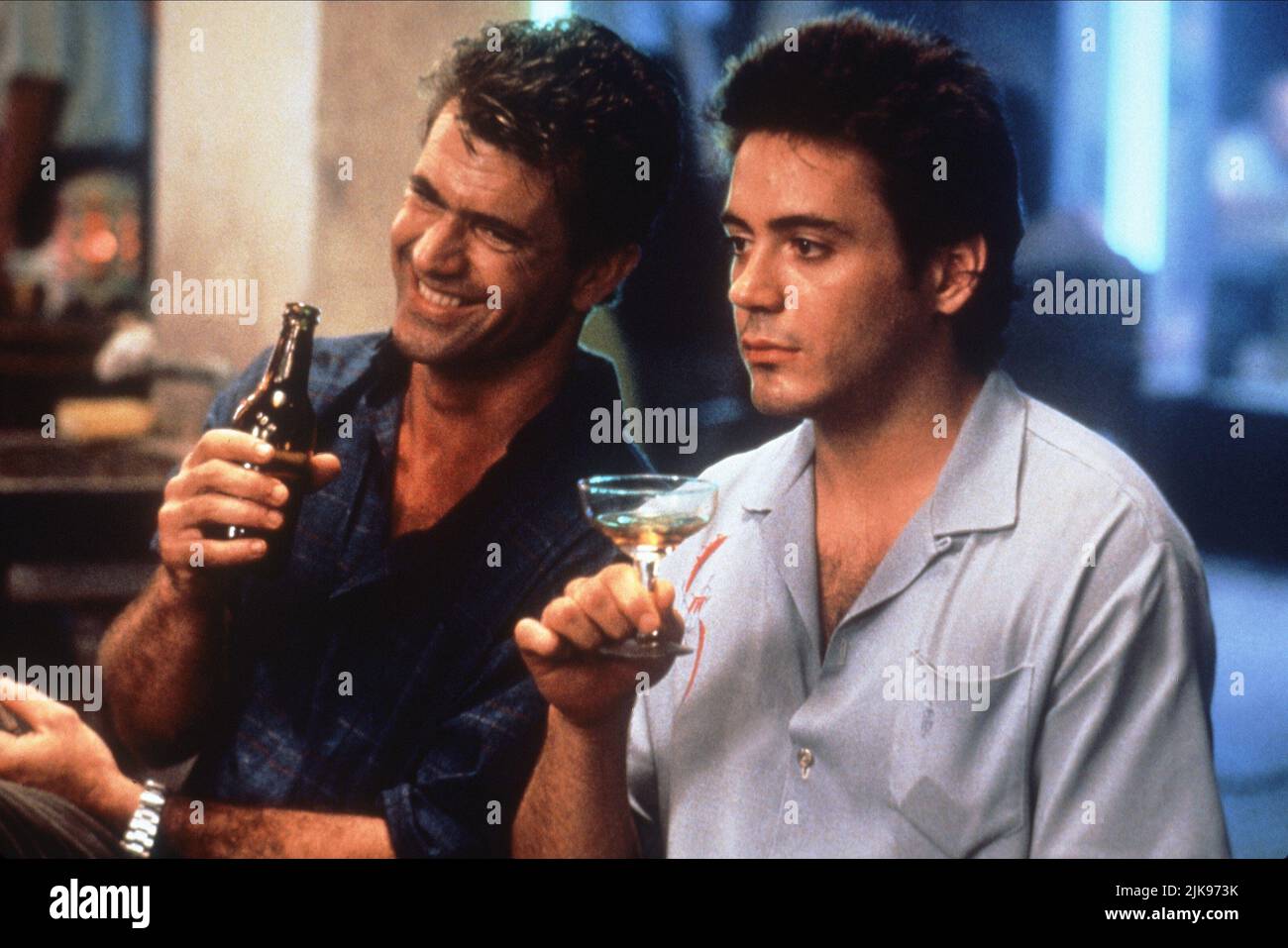 Mel Gibson & Robert Downey Jnr Film: Air America (1994) Characters: Gene Ryack, BILLY COVINGTON  Director: Roger Spottiswoode 10 August 1990   **WARNING** This Photograph is for editorial use only and is the copyright of TRISTAR and/or the Photographer assigned by the Film or Production Company and can only be reproduced by publications in conjunction with the promotion of the above Film. A Mandatory Credit To TRISTAR is required. The Photographer should also be credited when known. No commercial use can be granted without written authority from the Film Company. Stock Photo