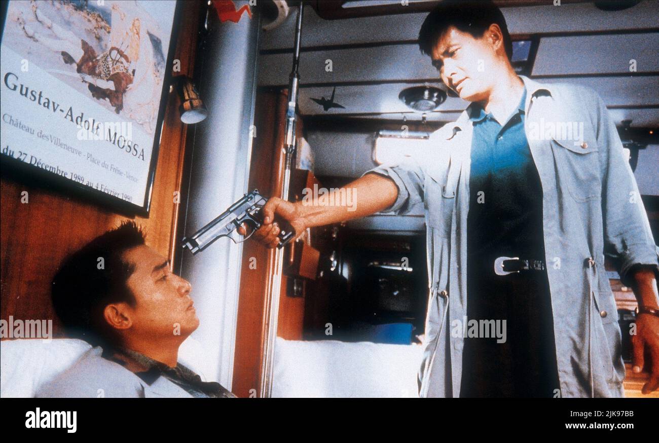 Tony Leung Chiu Wai & Yun-Fat Chow Film: Hard Boiled; Lat Sau San Taam (Lat sau san taam) Characters: Tony & Insp. 'Tequila' Yuen  Hk 1992, Director: John Woo 16 April 1992   **WARNING** This Photograph is for editorial use only and is the copyright of MILESTONE PICTURES and/or the Photographer assigned by the Film or Production Company and can only be reproduced by publications in conjunction with the promotion of the above Film. A Mandatory Credit To MILESTONE PICTURES is required. The Photographer should also be credited when known. No commercial use can be granted without written authority Stock Photo