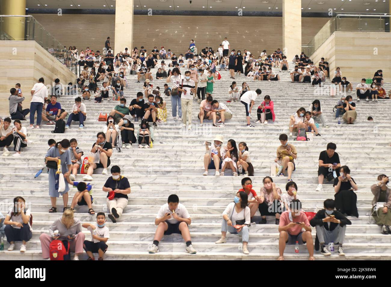 JINAN, CHINA - JULY 31, 2022 - Residents blow air conditioners to cool off at the Shandong Provincial Museum in Jinan, Shandong province, July 31, 202 Stock Photo