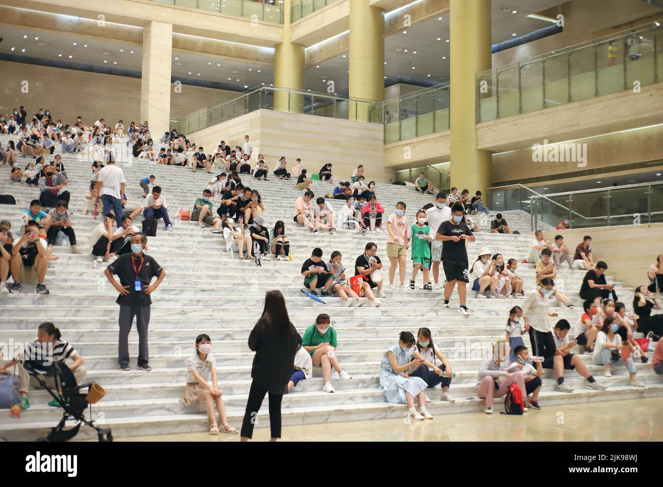 JINAN, CHINA - JULY 31, 2022 - Residents blow air conditioners to cool off at the Shandong Provincial Museum in Jinan, Shandong province, July 31, 202 Stock Photo