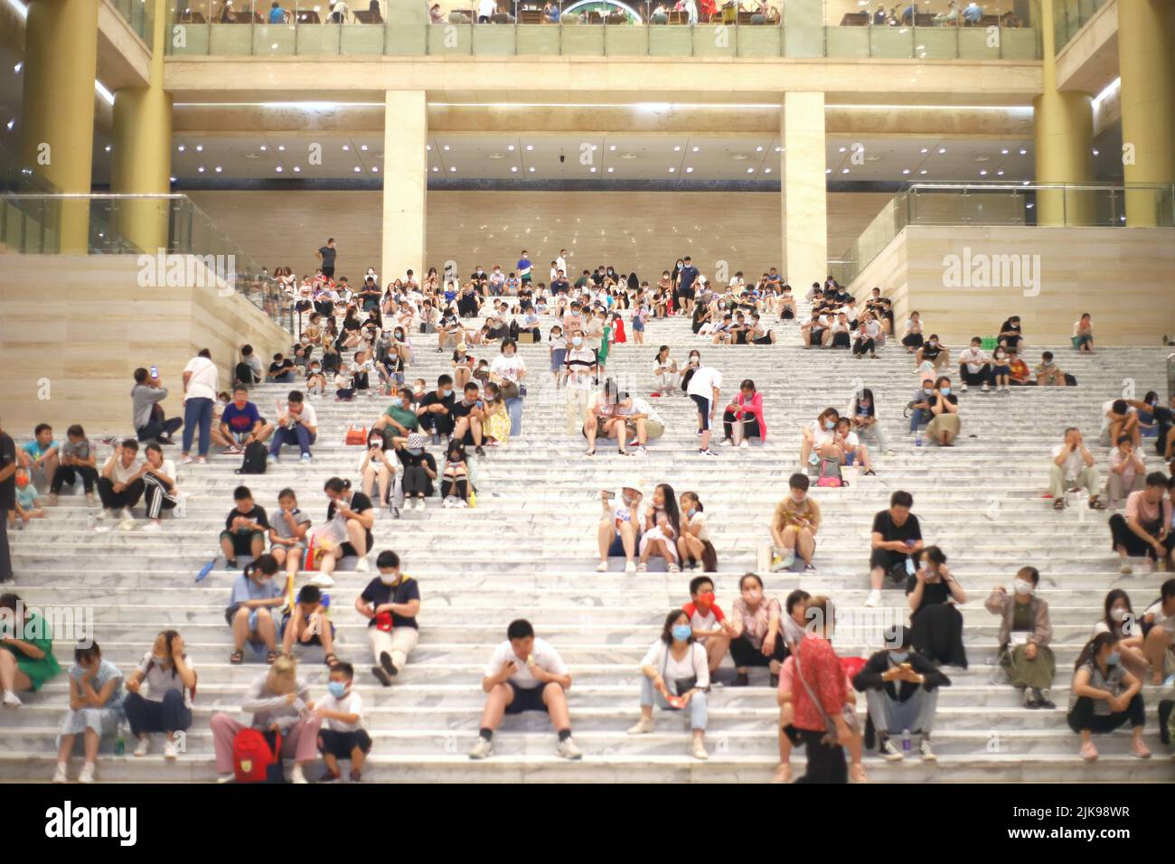 JINAN, CHINA - JULY 31, 2022 - Residents blow air conditioners to cool off at the Shandong Provincial Museum in Jinan, Shandong province, July 31, 202 Stock Photo