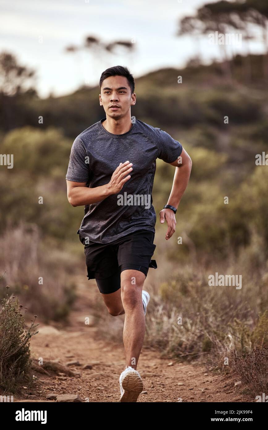 Its a good day for a run. a young man exercising in nature Stock Photo