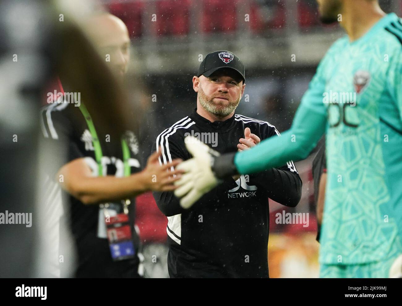 WASHINGTON, DC, USA - 31 JULY 2022: Head coach Wayne Rooney leaves the pitch with a smile on his face after a come from behind victory in extra time during a MLS match between D.C United and the Orlando City SC, on July 31, 2022, at Audi Field, in Washington, DC. (Photo by Tony Quinn-Alamy Live News) Stock Photo