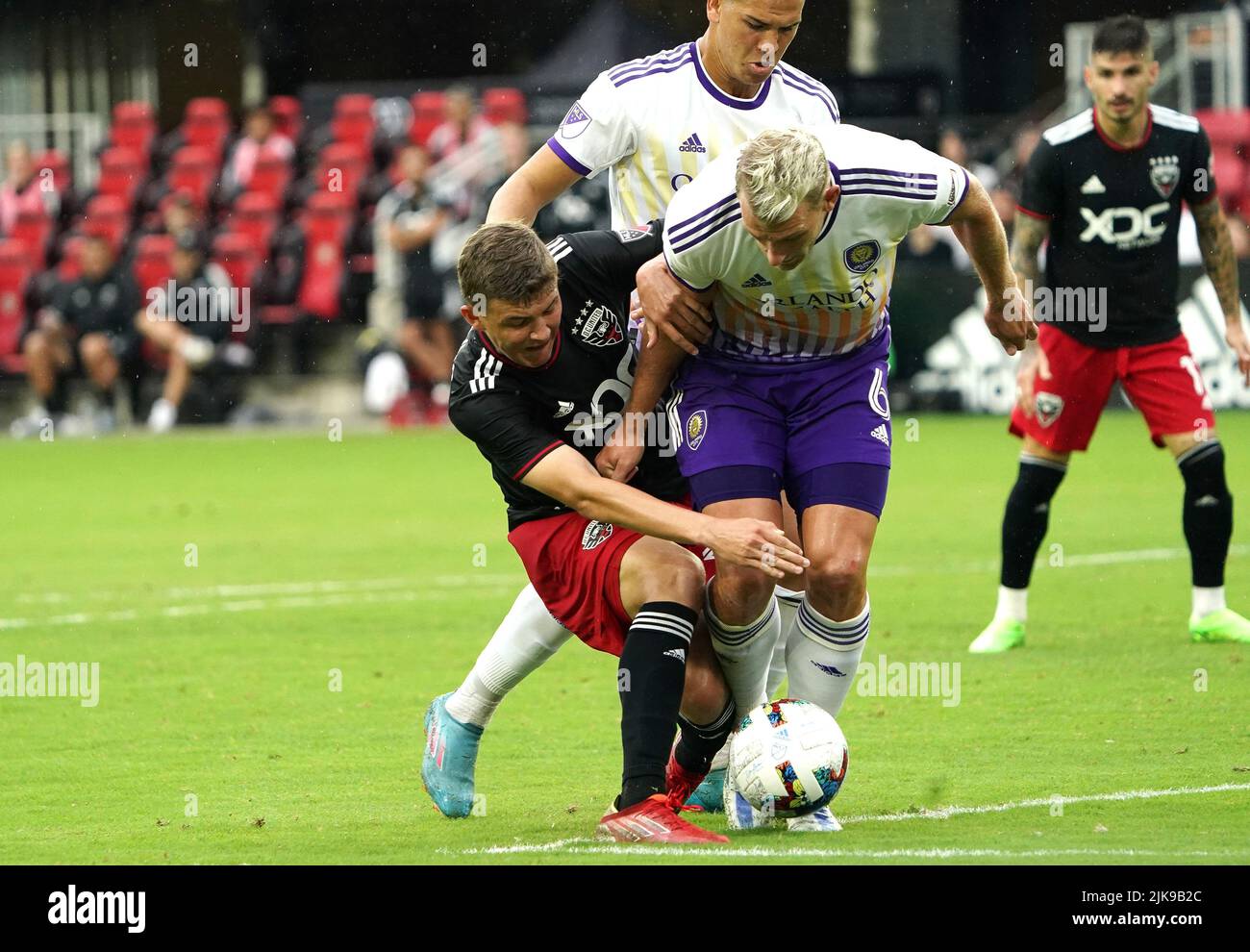 WASHINGTON, DC, USA - 31 JULY 2022: D.C. United midfielder Jackson Hopkins (25) clashes with Orlando City defender Robin Jansson (6) during a MLS match between D.C United and the Orlando City SC, on July 31, 2022, at Audi Field, in Washington, DC. (Photo by Tony Quinn-Alamy Live News) Stock Photo