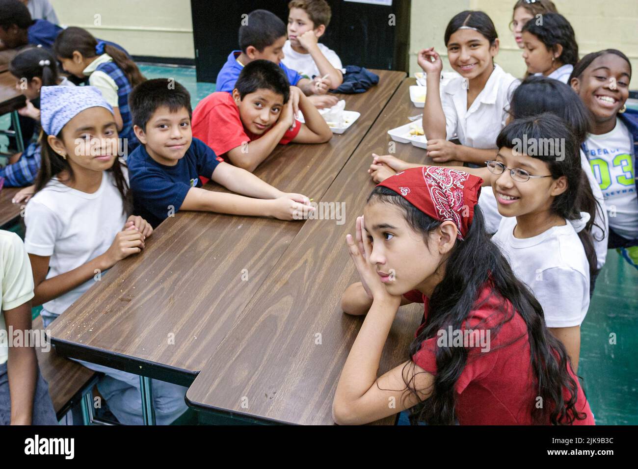 Miami Florida,Frederick Douglass Elementary School,inside,low income community,Black Hispanic students girls boys children classroom desk table Stock Photo