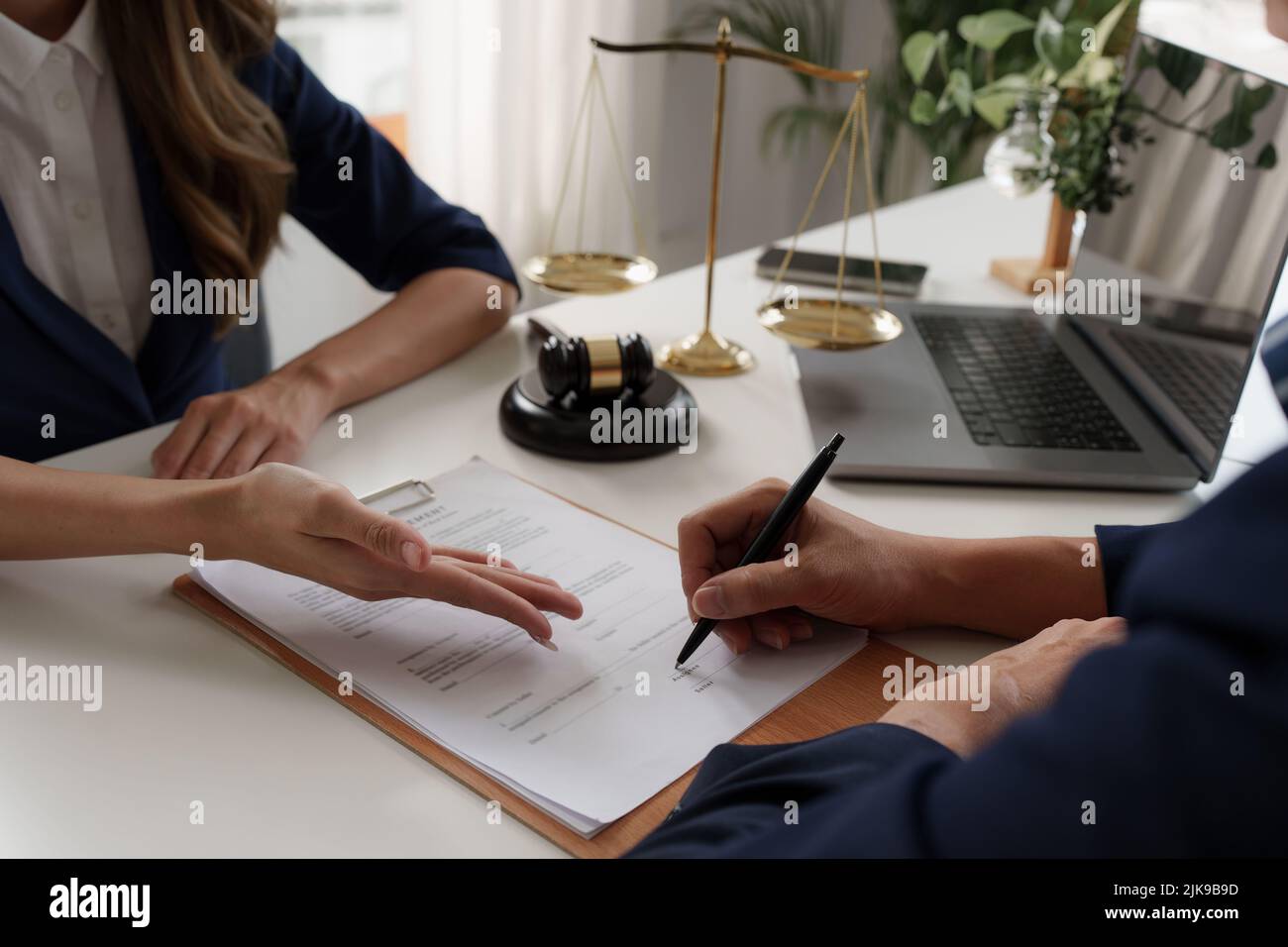 Real Estate Agent broker explain about agreement contract Stock Photo