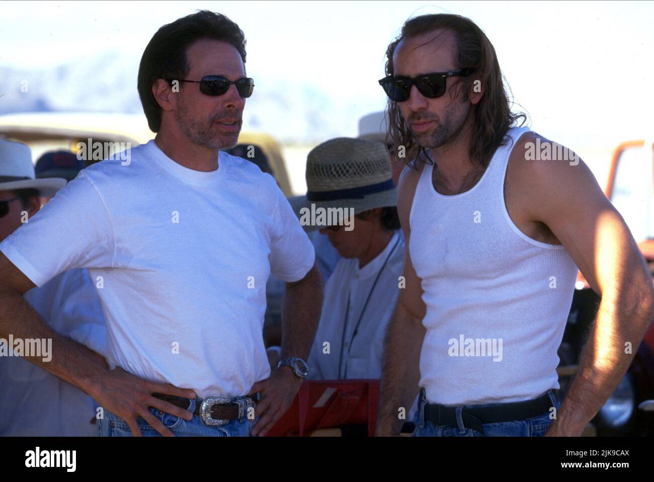 Jerry Bruckheimer & Nicolas Cage Film: Con Air (USA 1997) Characters: Cameron Poe  Director: Simon West 02 June 1997   **WARNING** This Photograph is for editorial use only and is the copyright of TOUCHSTONE PICTURES and/or the Photographer assigned by the Film or Production Company and can only be reproduced by publications in conjunction with the promotion of the above Film. A Mandatory Credit To TOUCHSTONE PICTURES is required. The Photographer should also be credited when known. No commercial use can be granted without written authority from the Film Company. Stock Photo