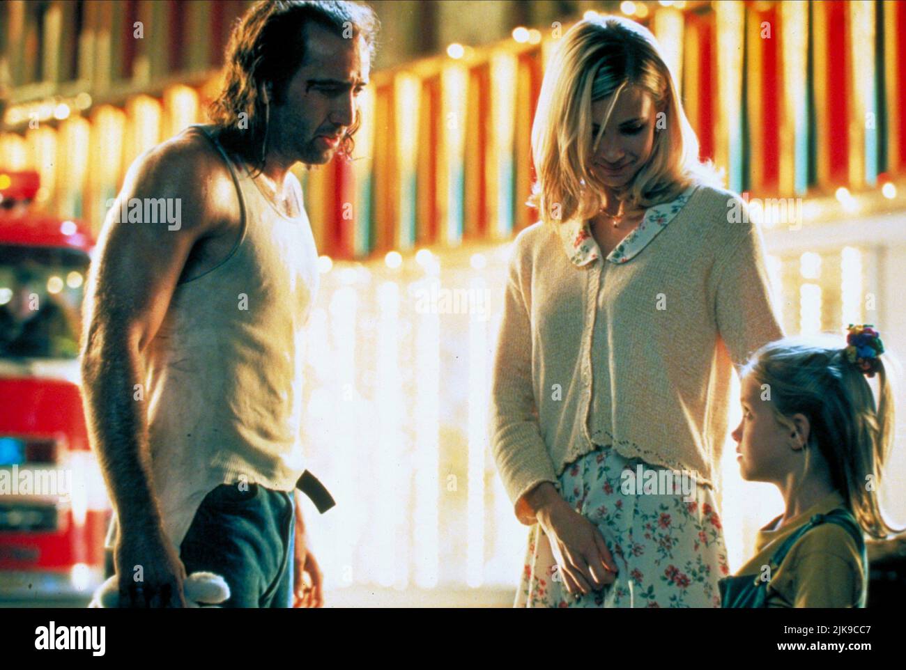 Nicolas Cage, Monica Potter & Landry Allbright Film: Con Air (USA 1997) Characters: Cameron Poe, Tricia Poe, Casey Poe  Director: Simon West 02 June 1997   **WARNING** This Photograph is for editorial use only and is the copyright of TOUCHSTONE PICTURES and/or the Photographer assigned by the Film or Production Company and can only be reproduced by publications in conjunction with the promotion of the above Film. A Mandatory Credit To TOUCHSTONE PICTURES is required. The Photographer should also be credited when known. No commercial use can be granted without written authority from the Film Co Stock Photo