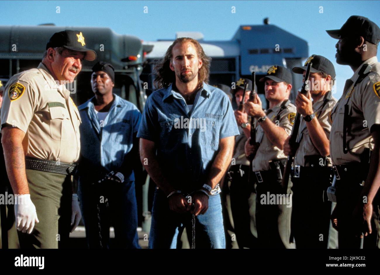 Scott Ditty & Nicolas Cage Film: Con Air (USA 1997) Characters: Bus Guard, Cameron Poe  Director: Simon West 02 June 1997   **WARNING** This Photograph is for editorial use only and is the copyright of TOUCHSTONE PICTURES and/or the Photographer assigned by the Film or Production Company and can only be reproduced by publications in conjunction with the promotion of the above Film. A Mandatory Credit To TOUCHSTONE PICTURES is required. The Photographer should also be credited when known. No commercial use can be granted without written authority from the Film Company. Stock Photo