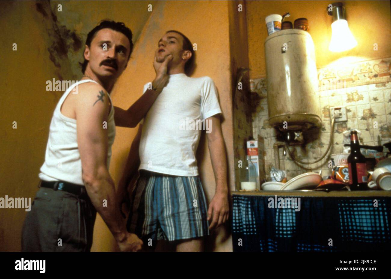 Robert Carlyle & Ewan Mcgregor Film: Trainspotting (UK 1996) Characters: Begbie, Renton  Director: Danny Boyle 23 February 1996   **WARNING** This Photograph is for editorial use only and is the copyright of CHANNEL FOUR FILMS and/or the Photographer assigned by the Film or Production Company and can only be reproduced by publications in conjunction with the promotion of the above Film. A Mandatory Credit To CHANNEL FOUR FILMS is required. The Photographer should also be credited when known. No commercial use can be granted without written authority from the Film Company. Stock Photo