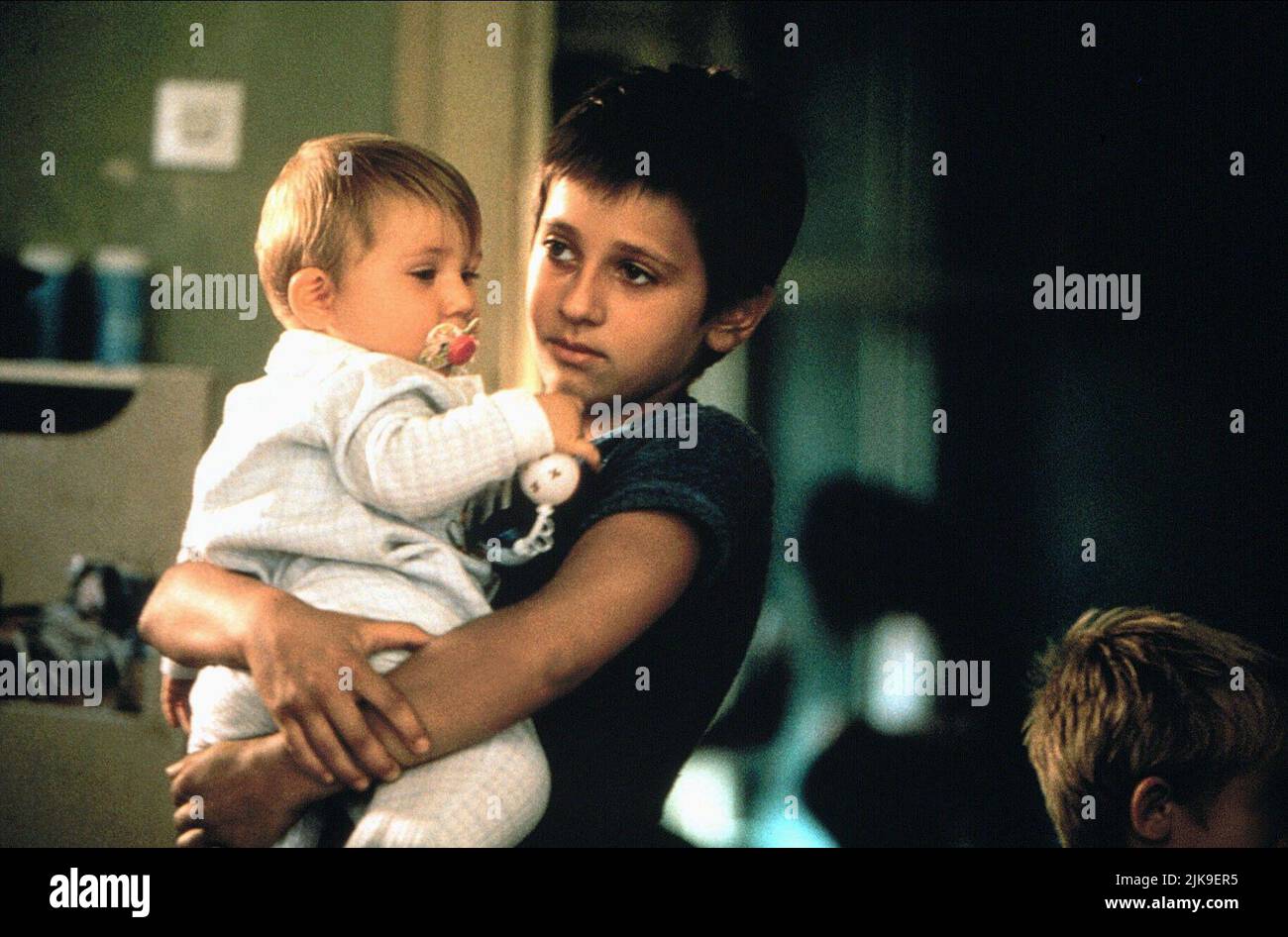 Emira Nusevic & Baby Film: Welcome To Sarajevo (1997) Characters: Emira &  Director: Michael Winterbottom 09 May 1997   **WARNING** This Photograph is for editorial use only and is the copyright of CHANNEL FOUR FILMS and/or the Photographer assigned by the Film or Production Company and can only be reproduced by publications in conjunction with the promotion of the above Film. A Mandatory Credit To CHANNEL FOUR FILMS is required. The Photographer should also be credited when known. No commercial use can be granted without written authority from the Film Company. Stock Photo