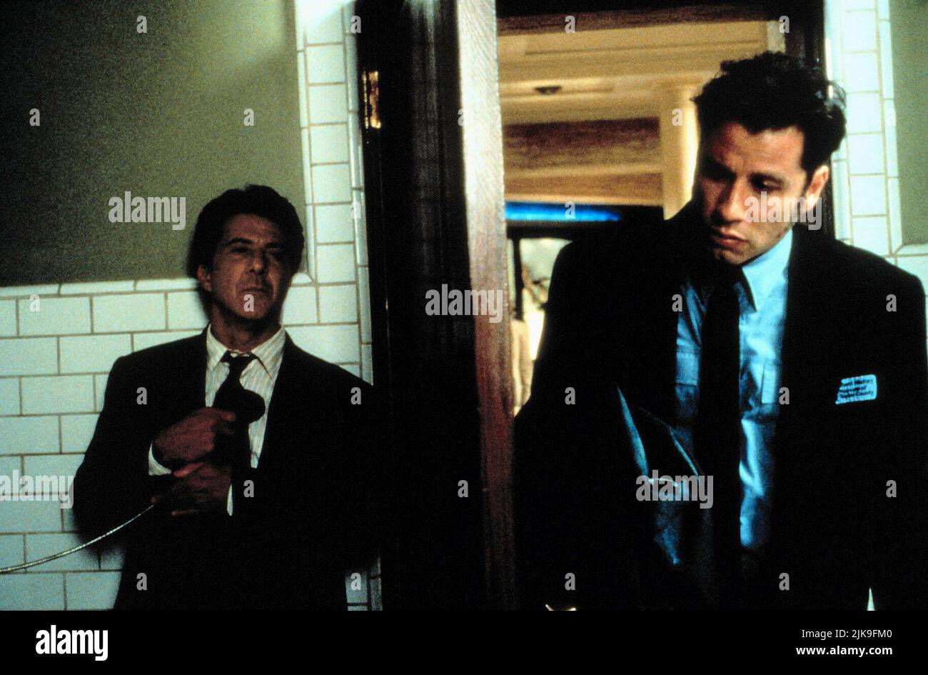 Dustin Hoffman & John Travolta Film: Mad City (1997) Characters: Max Brackett & Sam Baily  Director: Costa-Gavras 10 October 1997   **WARNING** This Photograph is for editorial use only and is the copyright of WARNER BROS and/or the Photographer assigned by the Film or Production Company and can only be reproduced by publications in conjunction with the promotion of the above Film. A Mandatory Credit To WARNER BROS is required. The Photographer should also be credited when known. No commercial use can be granted without written authority from the Film Company. Stock Photo