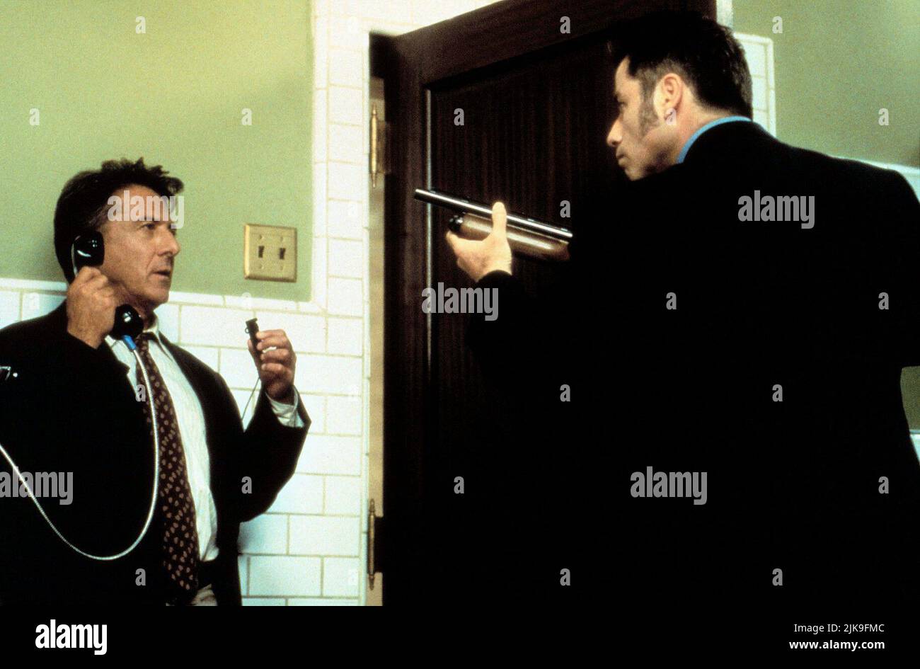 Dustin Hoffman & John Travolta Film: Mad City (1997) Characters: Max Brackett & Sam Baily  Director: Costa-Gavras 10 October 1997   **WARNING** This Photograph is for editorial use only and is the copyright of WARNER BROS and/or the Photographer assigned by the Film or Production Company and can only be reproduced by publications in conjunction with the promotion of the above Film. A Mandatory Credit To WARNER BROS is required. The Photographer should also be credited when known. No commercial use can be granted without written authority from the Film Company. Stock Photo