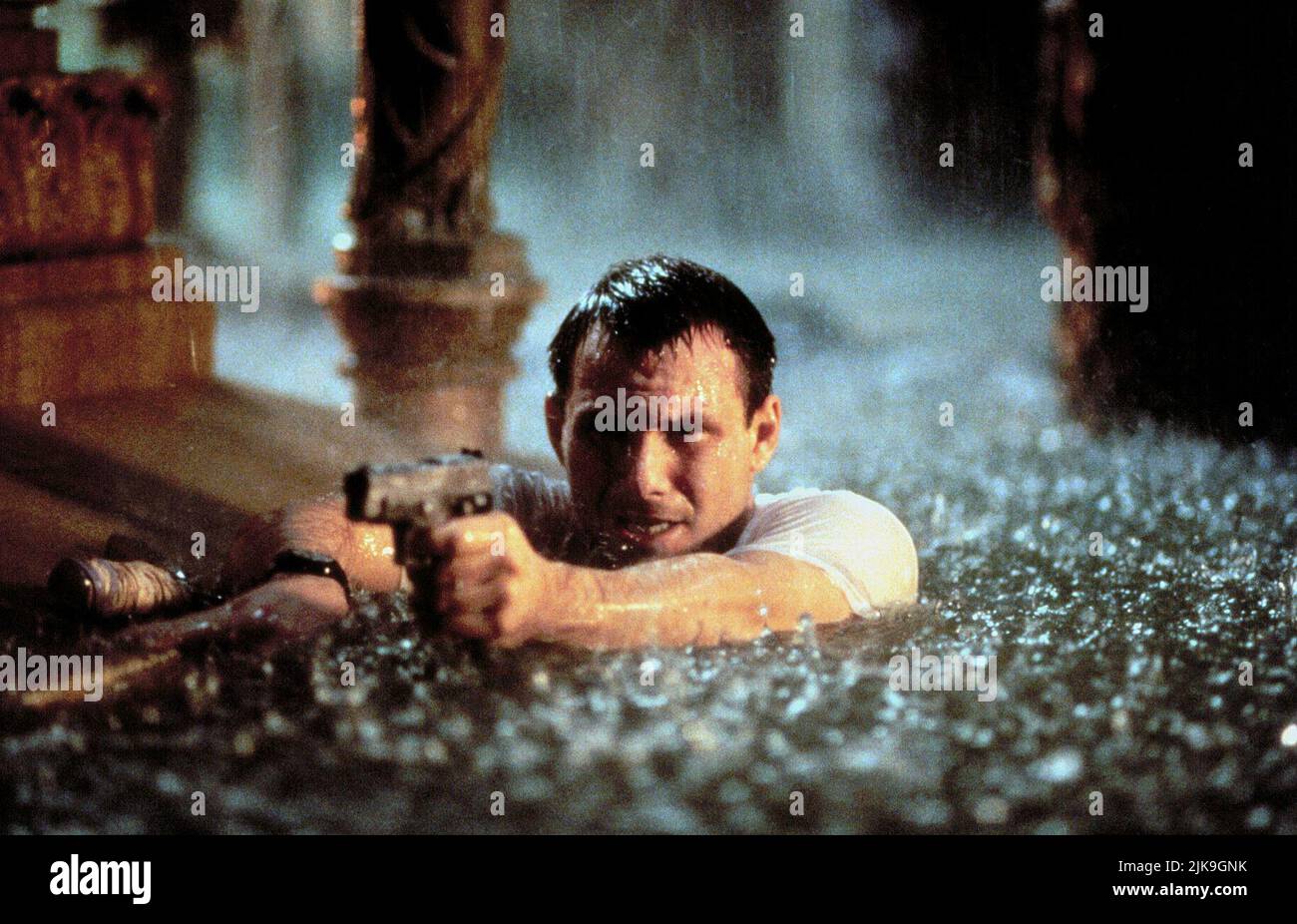 Christian Slater Film: Hard Rain (1998) Characters: Tom  Director: Mikael Salomon 16 January 1998   **WARNING** This Photograph is for editorial use only and is the copyright of PARAMOUNT and/or the Photographer assigned by the Film or Production Company and can only be reproduced by publications in conjunction with the promotion of the above Film. A Mandatory Credit To PARAMOUNT is required. The Photographer should also be credited when known. No commercial use can be granted without written authority from the Film Company. Stock Photo