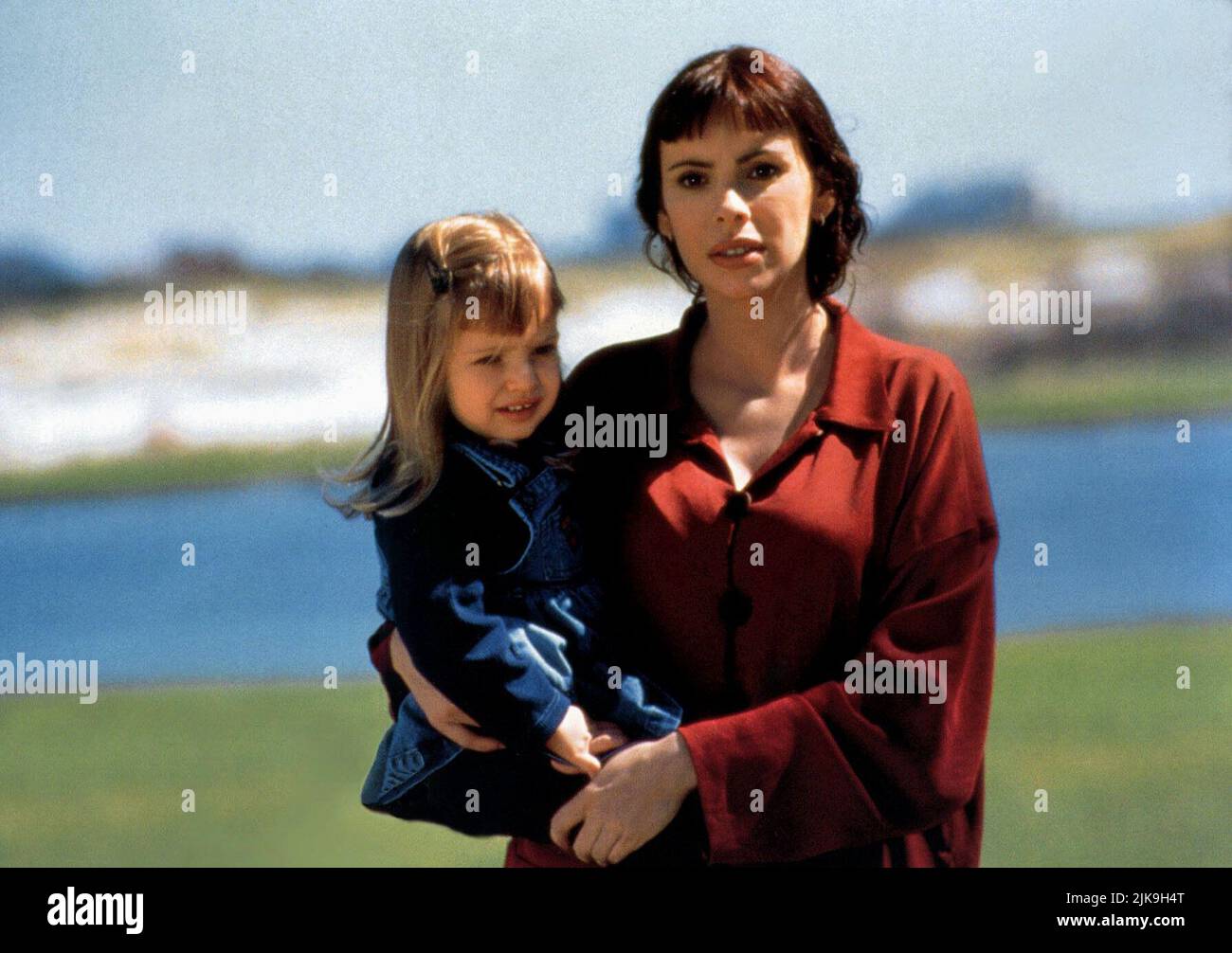 Mathilda May With Child Film: The Jackal (1997) Characters: Isabella Zanconia WITH  Director: Michael Caton-Jones 14 November 1997   **WARNING** This Photograph is for editorial use only and is the copyright of MCAUNIVERSAL and/or the Photographer assigned by the Film or Production Company and can only be reproduced by publications in conjunction with the promotion of the above Film. A Mandatory Credit To MCAUNIVERSAL is required. The Photographer should also be credited when known. No commercial use can be granted without written authority from the Film Company. Stock Photo