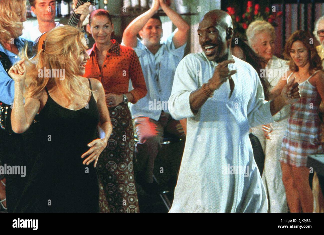 Kelly Preston & Eddie Murphy Film: Holy Man (USA 1998) Characters: Kate Newell & G  Director: Stephen Herek 09 October 1998   **WARNING** This Photograph is for editorial use only and is the copyright of TOUCHSTONE PICTURES and/or the Photographer assigned by the Film or Production Company and can only be reproduced by publications in conjunction with the promotion of the above Film. A Mandatory Credit To TOUCHSTONE PICTURES is required. The Photographer should also be credited when known. No commercial use can be granted without written authority from the Film Company. Stock Photo