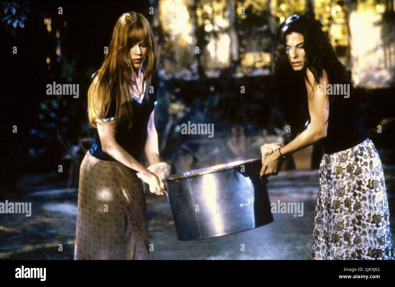 Nicole Kidman & Sandra Bullock Film: Practical Magic (USA/AUS 1998) Characters: Gillian Owens & Sally Owens  Director: Griffin Dunne 16 October 1998   **WARNING** This Photograph is for editorial use only and is the copyright of WARNER BROS. and/or the Photographer assigned by the Film or Production Company and can only be reproduced by publications in conjunction with the promotion of the above Film. A Mandatory Credit To WARNER BROS. is required. The Photographer should also be credited when known. No commercial use can be granted without written authority from the Film Company. Stock Photo