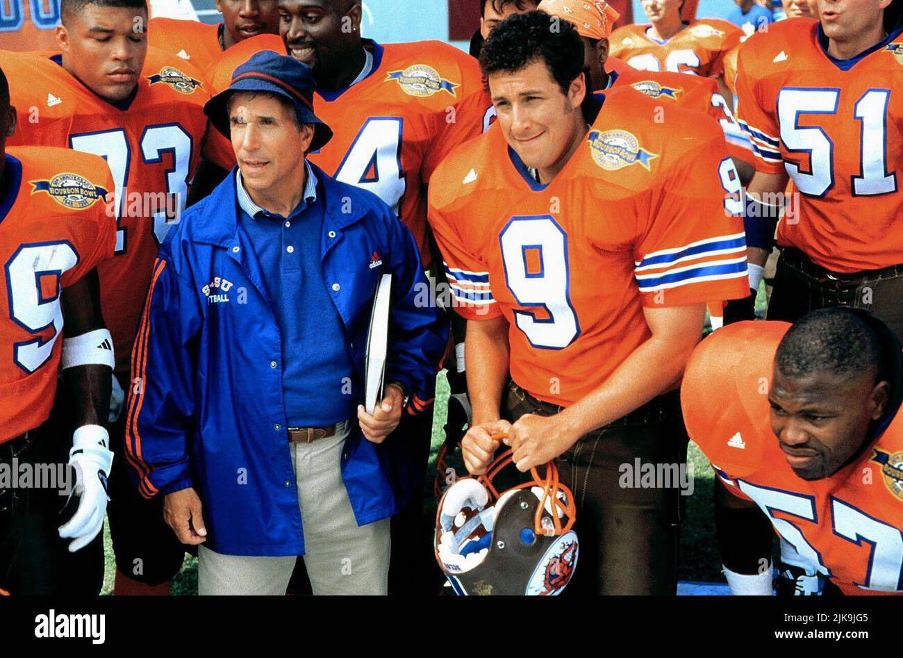 Henry Winkler & Adam Sandler Film: The Waterboy (1998) Characters: Coach Klein & Robert 'Bobby' Boucher Jr.  Director: Frank Coraci 06 November 1998   **WARNING** This Photograph is for editorial use only and is the copyright of TOUCHSTONE and/or the Photographer assigned by the Film or Production Company and can only be reproduced by publications in conjunction with the promotion of the above Film. A Mandatory Credit To TOUCHSTONE is required. The Photographer should also be credited when known. No commercial use can be granted without written authority from the Film Company. Stock Photo
