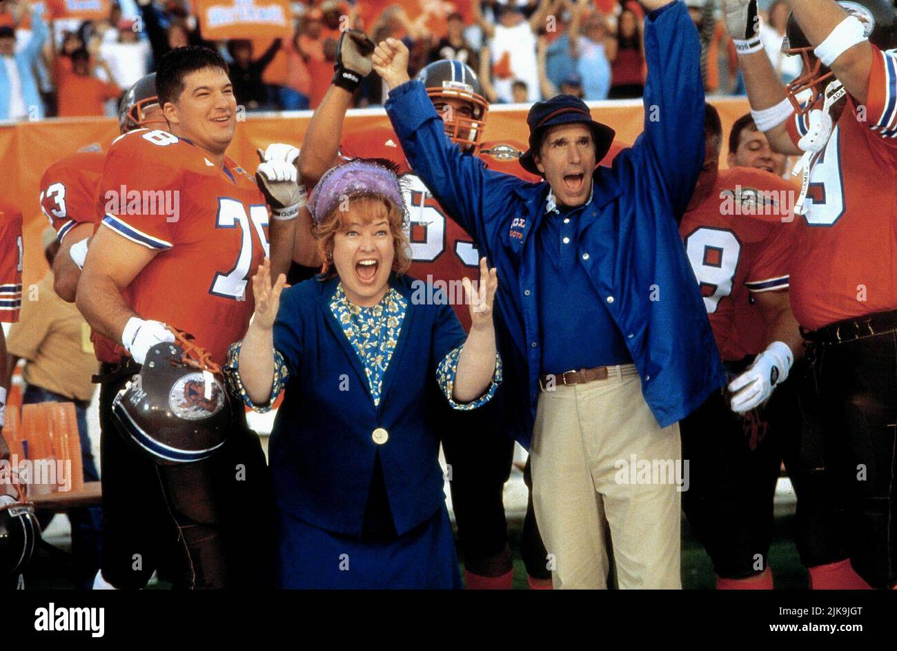 Kathy Bates & Henry Winkler Film: The Waterboy (1998) Characters: Helen 'Mama' Boucher & Coach Klein  Director: Frank Coraci 06 November 1998   **WARNING** This Photograph is for editorial use only and is the copyright of TOUCHSTONE and/or the Photographer assigned by the Film or Production Company and can only be reproduced by publications in conjunction with the promotion of the above Film. A Mandatory Credit To TOUCHSTONE is required. The Photographer should also be credited when known. No commercial use can be granted without written authority from the Film Company. Stock Photo