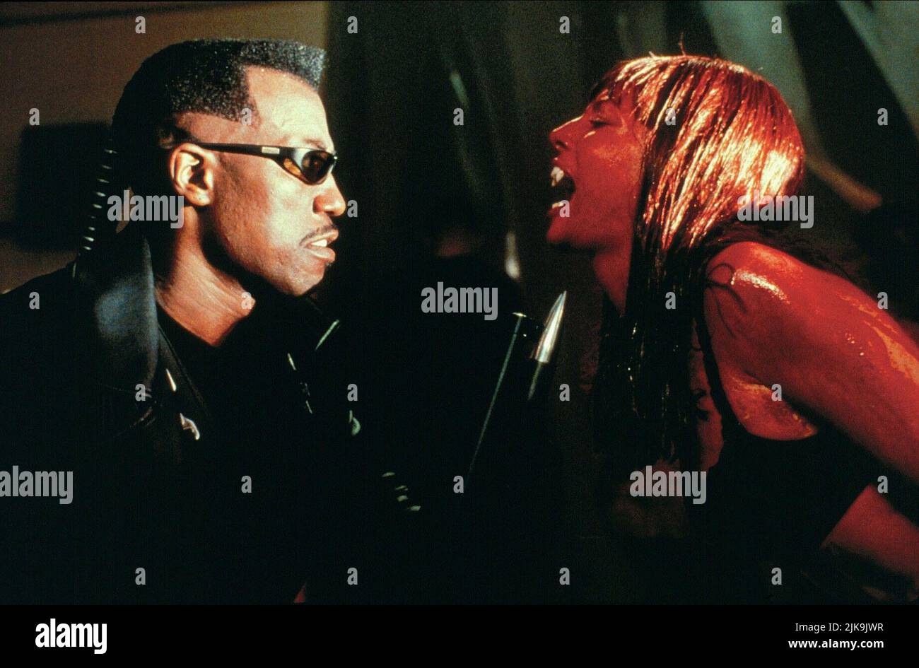 Wesley Snipes & Traci Lords Film: Blade (USA 1998) Characters: Blade & Racquel  Director: Stephen Norrington 19 August 1998   **WARNING** This Photograph is for editorial use only and is the copyright of MARVEL ENTERPRISES and/or the Photographer assigned by the Film or Production Company and can only be reproduced by publications in conjunction with the promotion of the above Film. A Mandatory Credit To MARVEL ENTERPRISES is required. The Photographer should also be credited when known. No commercial use can be granted without written authority from the Film Company. Stock Photo