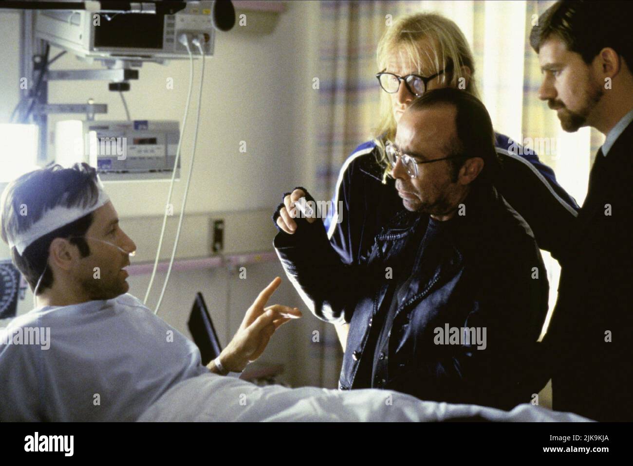 David Duchovny, Dean Haglund, Tom Braidwood, Bruce Harwood Film: The X Files; The X-Files: Fight The Future; The (USA 1998) Characters: Special Agent Fox Mulder,Richard 'Ringo' Langly,Melvin Frohike,John Fitzgerald Byers  Director: Rob Bowman 19 June 1998   **WARNING** This Photograph is for editorial use only and is the copyright of 20TH CENTURY FOX and/or the Photographer assigned by the Film or Production Company and can only be reproduced by publications in conjunction with the promotion of the above Film. A Mandatory Credit To 20TH CENTURY FOX is required. The Photographer should also be Stock Photo