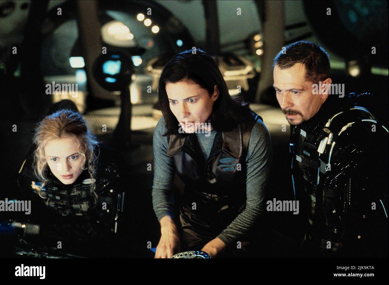 Heather Graham, Mimi Rogers, Gary Oldman Film: Lost In Space (USA 1998) Characters: Dr. Judy Robinson,Dr. Maureen Robinson,Spider Smith  Director: Stephen Hopkins 03 April 1998   **WARNING** This Photograph is for editorial use only and is the copyright of NEW LINE CINEMA and/or the Photographer assigned by the Film or Production Company and can only be reproduced by publications in conjunction with the promotion of the above Film. A Mandatory Credit To NEW LINE CINEMA is required. The Photographer should also be credited when known. No commercial use can be granted without written authority f Stock Photo