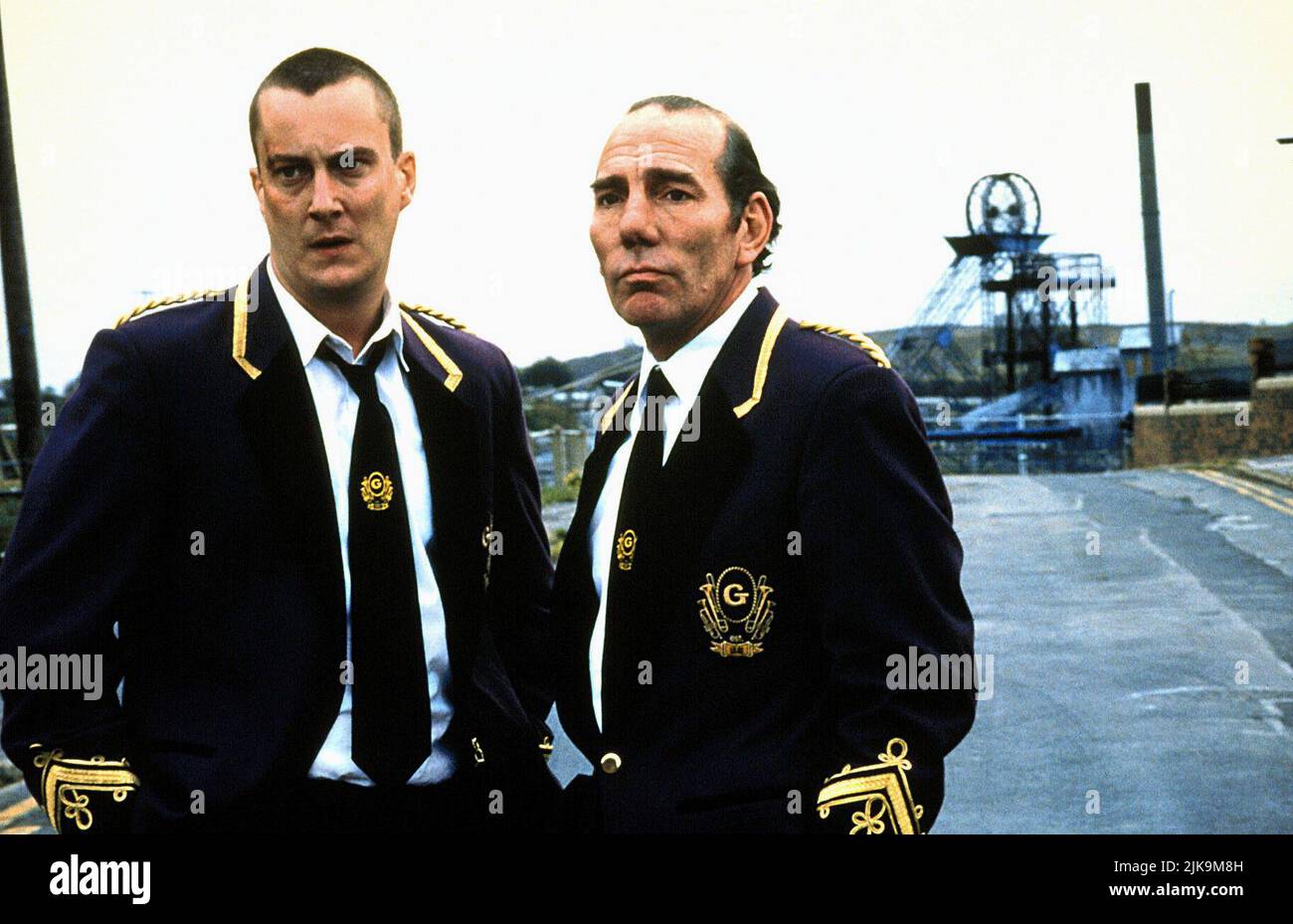 Stephen Tompkinson & Pete Postlethwaite Film: Brassed Off (1996) Characters: Phil & Danny  Director: Mark Herman 01 November 1996   **WARNING** This Photograph is for editorial use only and is the copyright of CHANNEL FOUR and/or the Photographer assigned by the Film or Production Company and can only be reproduced by publications in conjunction with the promotion of the above Film. A Mandatory Credit To CHANNEL FOUR is required. The Photographer should also be credited when known. No commercial use can be granted without written authority from the Film Company. Stock Photo
