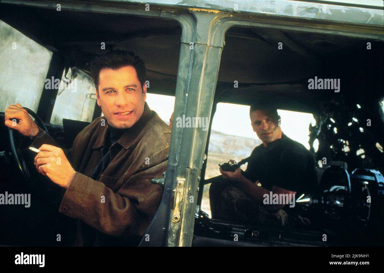 John Travolta & Howie Long Film: Broken Arrow (USA 1996) Characters: Maj. Vic 'Deak' Deakins & Kelly  Director: John Woo 09 February 1996   **WARNING** This Photograph is for editorial use only and is the copyright of 20TH CENTURY FOX and/or the Photographer assigned by the Film or Production Company and can only be reproduced by publications in conjunction with the promotion of the above Film. A Mandatory Credit To 20TH CENTURY FOX is required. The Photographer should also be credited when known. No commercial use can be granted without written authority from the Film Company. Stock Photo