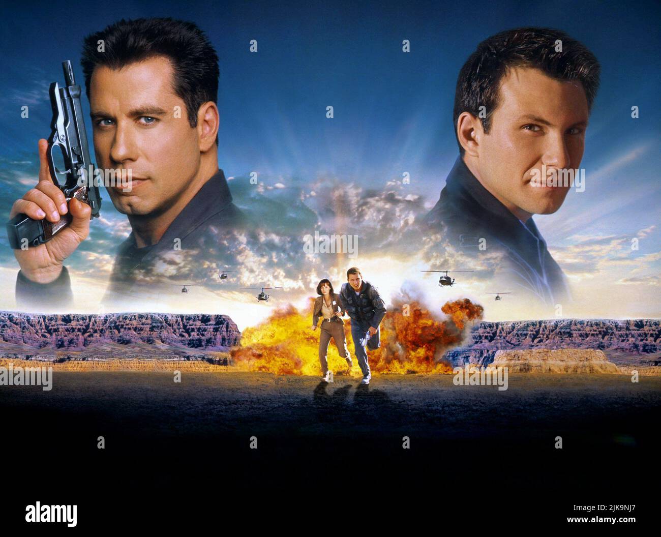John Travolta, Samantha Mathis & Christian Slater Film: Broken Arrow (USA 1996) Characters: Maj. Vic 'Deak' Deakins,Capt. Riley Hale,Terry Carmichael  Director: John Woo 09 February 1996   **WARNING** This Photograph is for editorial use only and is the copyright of 20TH CENTURY FOX and/or the Photographer assigned by the Film or Production Company and can only be reproduced by publications in conjunction with the promotion of the above Film. A Mandatory Credit To 20TH CENTURY FOX is required. The Photographer should also be credited when known. No commercial use can be granted without written Stock Photo