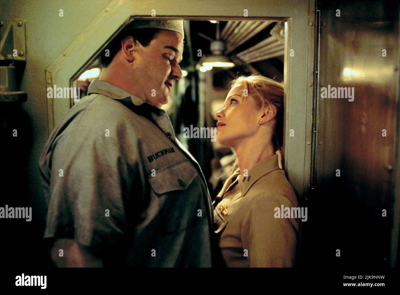 Ken Hudson Campbell & Lauren Holly Film: Down Periscope (USA 1996) Characters: Seaman Buckman,Lt. Emily Lake, Diving Officer  Director: David S. Ward 01 March 1996   **WARNING** This Photograph is for editorial use only and is the copyright of 20TH CENTURY FOX and/or the Photographer assigned by the Film or Production Company and can only be reproduced by publications in conjunction with the promotion of the above Film. A Mandatory Credit To 20TH CENTURY FOX is required. The Photographer should also be credited when known. No commercial use can be granted without written authority from the Fil Stock Photo