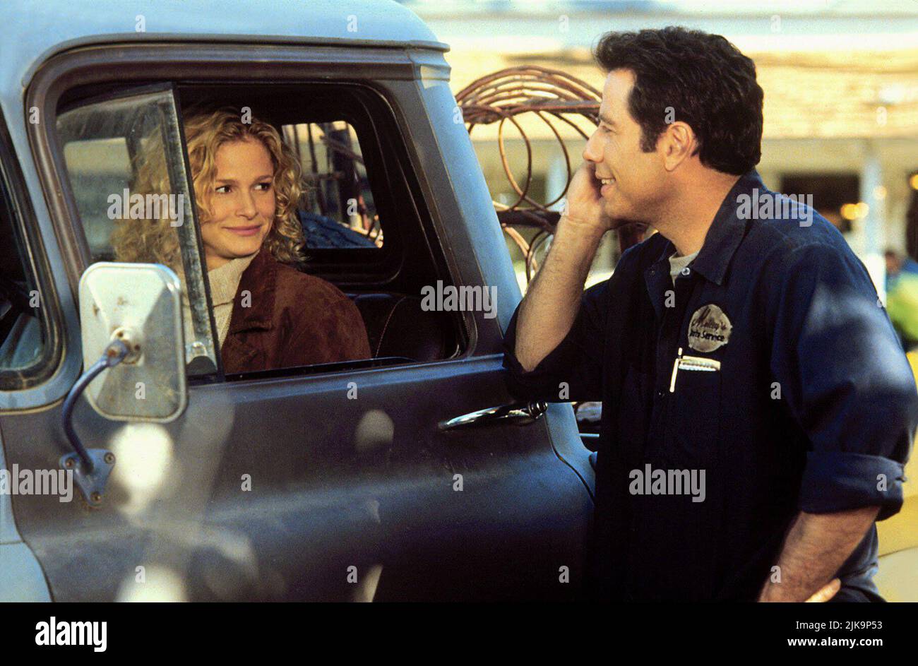 Kyra Sedgwick & John Travolta Film: Phenomenon (1996) Characters: Lace Pennamin & George Malley  Director: Jon Turteltaub 03 July 1996   **WARNING** This Photograph is for editorial use only and is the copyright of TOUCHSTONE and/or the Photographer assigned by the Film or Production Company and can only be reproduced by publications in conjunction with the promotion of the above Film. A Mandatory Credit To TOUCHSTONE is required. The Photographer should also be credited when known. No commercial use can be granted without written authority from the Film Company. Stock Photo
