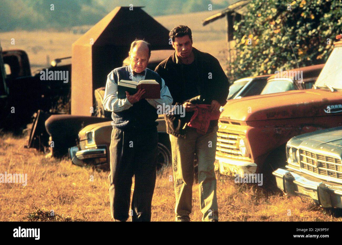 Robert Duvall & John Travolta Film: Phenomenon (1996) Characters: Doc Brunder & George Malley  Director: Jon Turteltaub 03 July 1996   **WARNING** This Photograph is for editorial use only and is the copyright of TOUCHSTONE and/or the Photographer assigned by the Film or Production Company and can only be reproduced by publications in conjunction with the promotion of the above Film. A Mandatory Credit To TOUCHSTONE is required. The Photographer should also be credited when known. No commercial use can be granted without written authority from the Film Company. Stock Photo