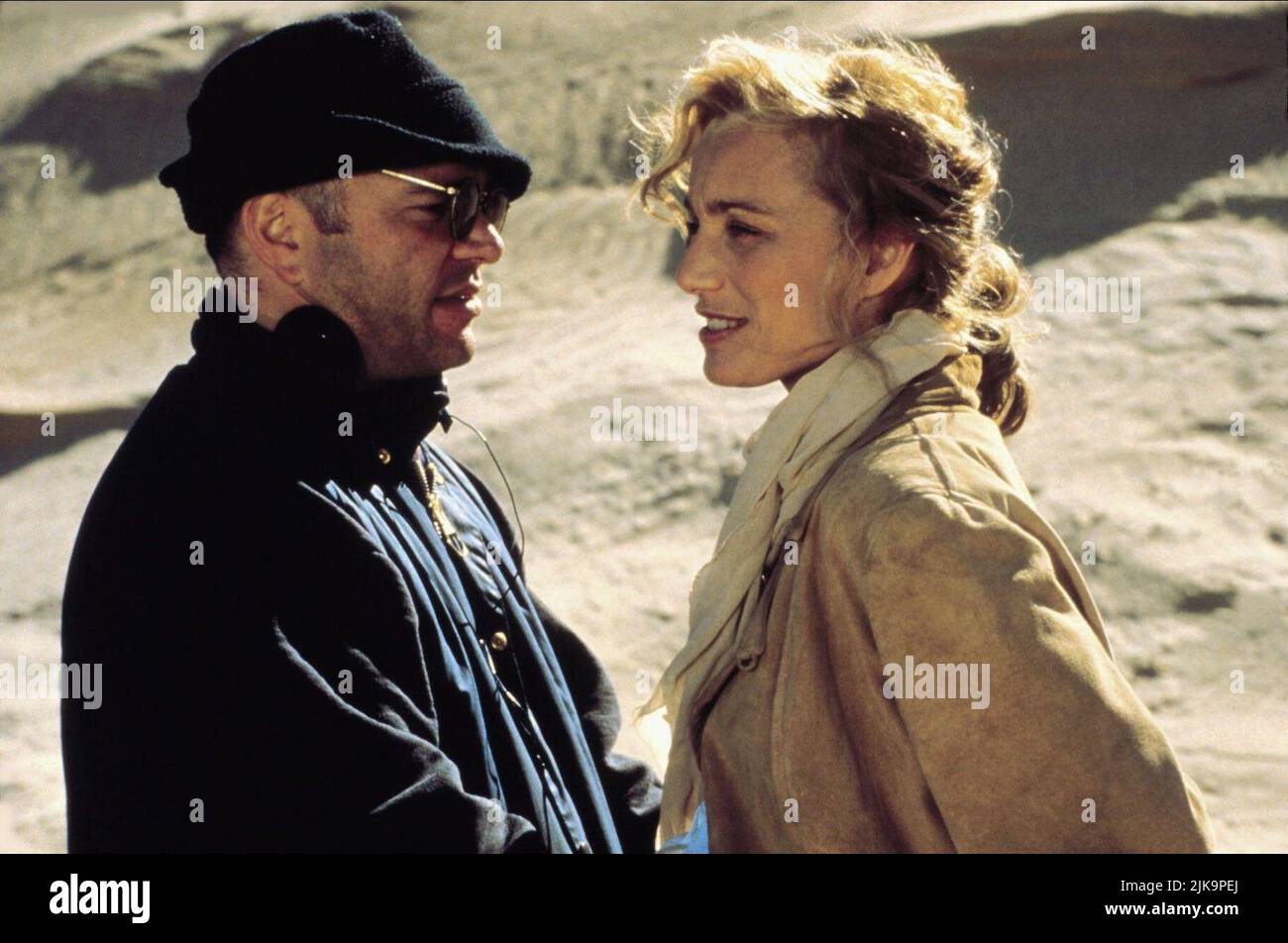 Anthony Minghella & Kristin Scott Thomas Film: The English Patient (USA/UK 1996) Characters: & Katharine Clifton  Director: Anthony Minghella 06 November 1996   **WARNING** This Photograph is for editorial use only and is the copyright of TIGER MOTH PRODUCTIONS and/or the Photographer assigned by the Film or Production Company and can only be reproduced by publications in conjunction with the promotion of the above Film. A Mandatory Credit To TIGER MOTH PRODUCTIONS is required. The Photographer should also be credited when known. No commercial use can be granted without written authority from Stock Photo