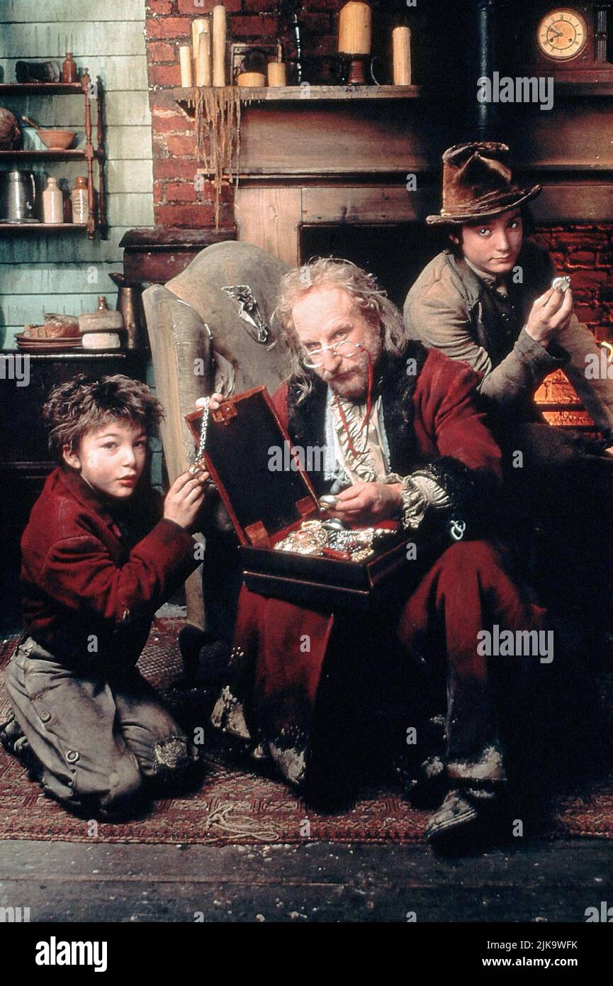 Alex Trench, Richard Dreyfuss & Elijah Wood Film: Oliver Twist (1997) Characters: Oliver Twist,Fagin & The Artful Dodger  Director: Tony Bill 16 November 1997   **WARNING** This Photograph is for editorial use only and is the copyright of DISNEY and/or the Photographer assigned by the Film or Production Company and can only be reproduced by publications in conjunction with the promotion of the above Film. A Mandatory Credit To DISNEY is required. The Photographer should also be credited when known. No commercial use can be granted without written authority from the Film Company. Stock Photo