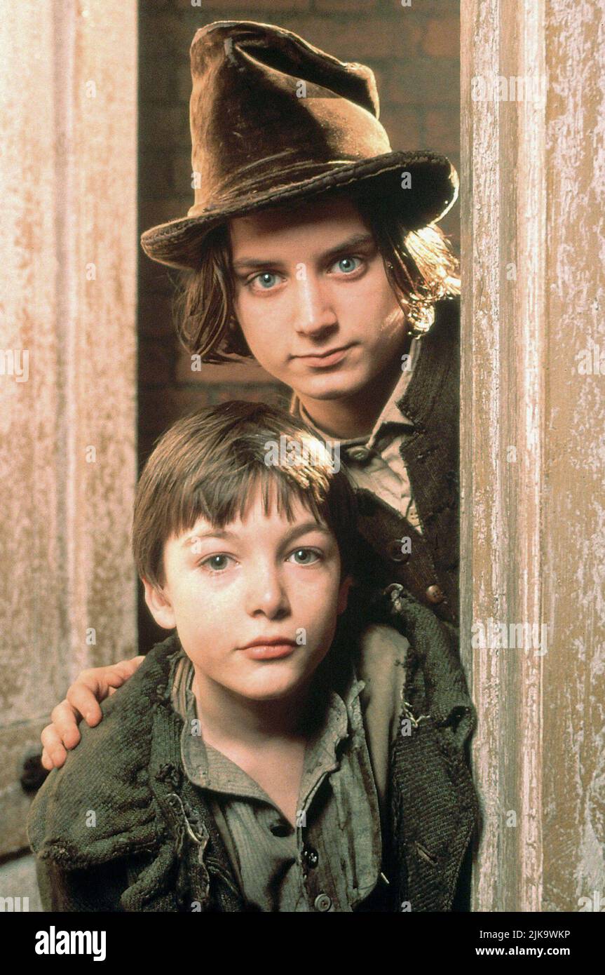 Alex Trench & Elijah Wood Film: Oliver Twist (1997) Characters: Oliver Twist & The Artful Dodger  Director: Tony Bill 16 November 1997   **WARNING** This Photograph is for editorial use only and is the copyright of DISNEY and/or the Photographer assigned by the Film or Production Company and can only be reproduced by publications in conjunction with the promotion of the above Film. A Mandatory Credit To DISNEY is required. The Photographer should also be credited when known. No commercial use can be granted without written authority from the Film Company. Stock Photo