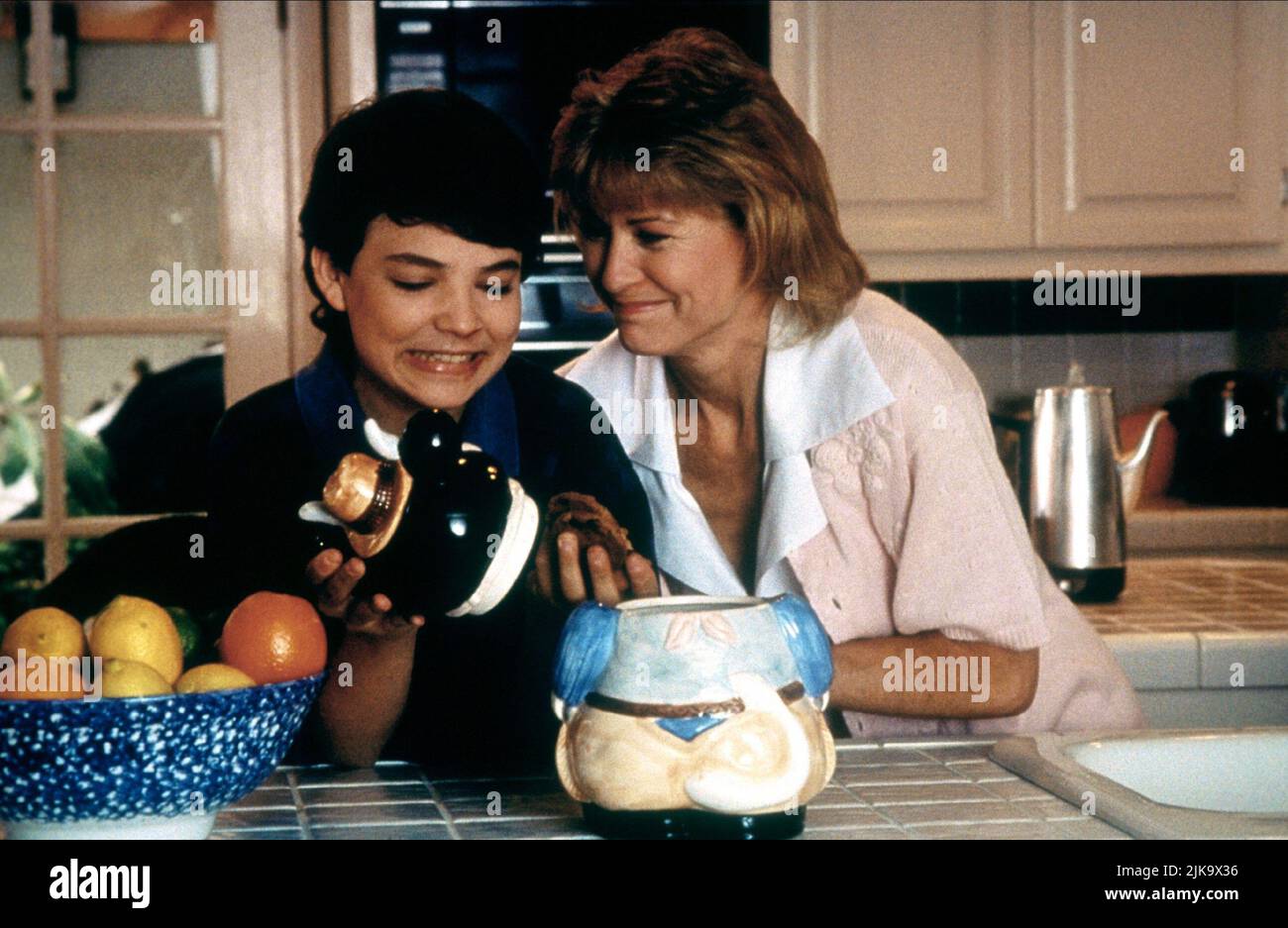 Trenton Knight & Dee Wallace Film: Invisible Mom (1995) Characters: Josh Griffin & Laura Griffin (as Dee Wallace-Stone)  Director: Fred Olen Ray 28 February 1996   **WARNING** This Photograph is for editorial use only and is the copyright of ROYAL OAKS ENTERTAINMENT INC. and/or the Photographer assigned by the Film or Production Company and can only be reproduced by publications in conjunction with the promotion of the above Film. A Mandatory Credit To ROYAL OAKS ENTERTAINMENT INC. is required. The Photographer should also be credited when known. No commercial use can be granted without writte Stock Photo