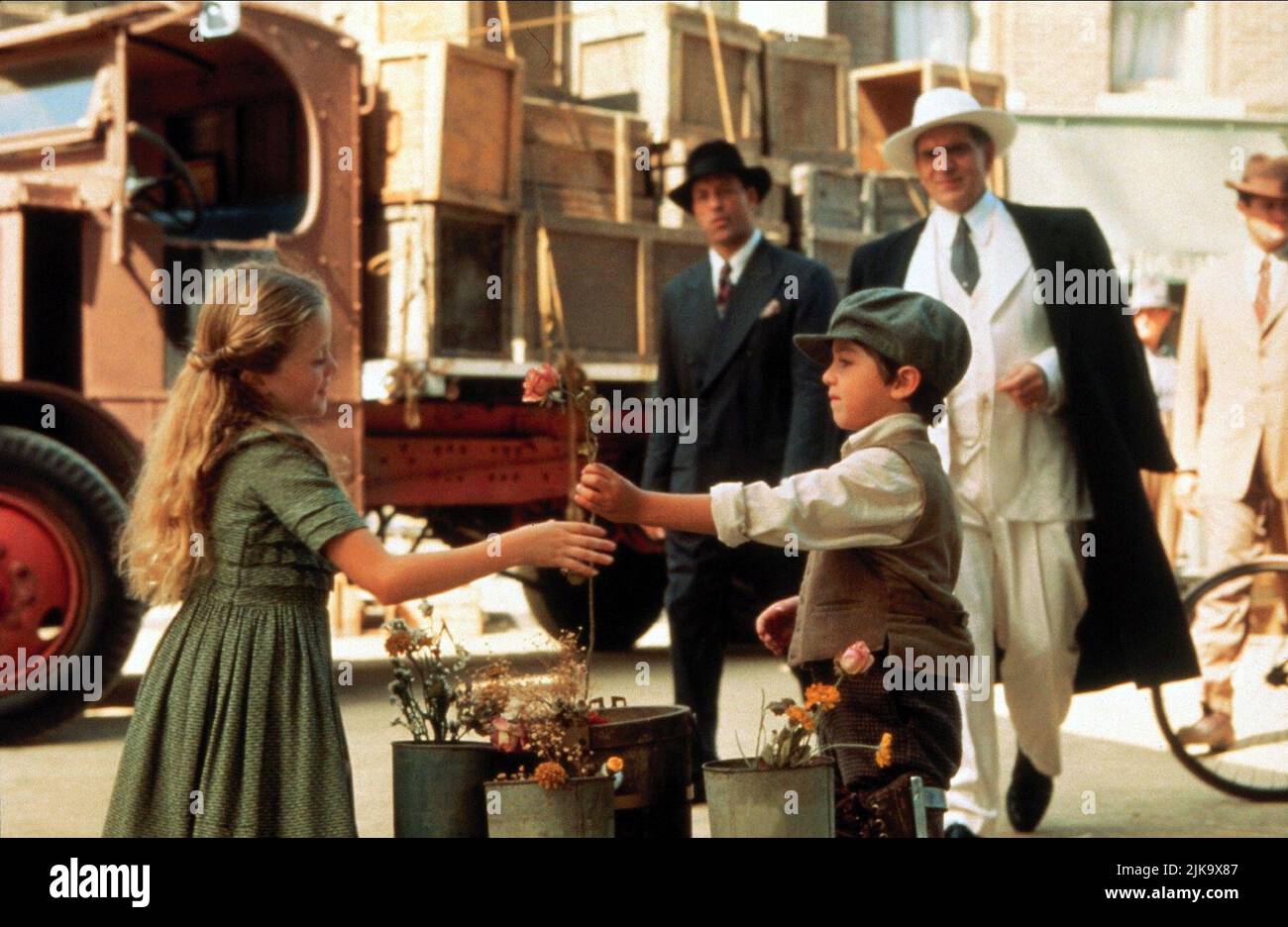 Flower Seller Scene Film: Mafia!; Jane Austen'S Mafia (1998)   Director: Jim Abrahams 24 July 1998   **WARNING** This Photograph is for editorial use only and is the copyright of TOUCHSTONE and/or the Photographer assigned by the Film or Production Company and can only be reproduced by publications in conjunction with the promotion of the above Film. A Mandatory Credit To TOUCHSTONE is required. The Photographer should also be credited when known. No commercial use can be granted without written authority from the Film Company. Stock Photo