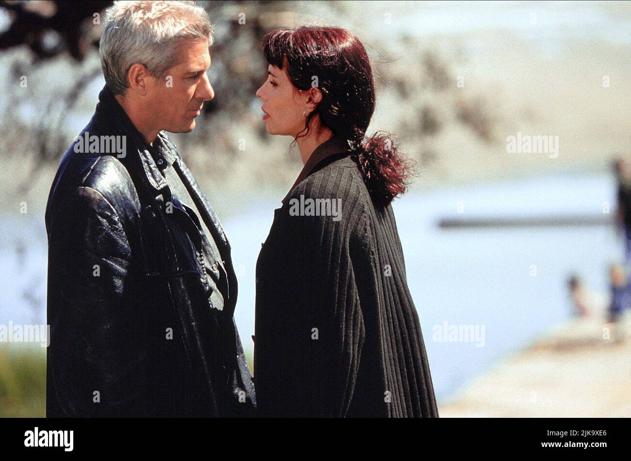 Richard Gere & Mathilda May Film: The Jackal (1997) Characters: Declan Mulqueen, Isabella Zanconia  Director: Michael Caton-Jones 14 November 1997   **WARNING** This Photograph is for editorial use only and is the copyright of MCAUNIVERSAL and/or the Photographer assigned by the Film or Production Company and can only be reproduced by publications in conjunction with the promotion of the above Film. A Mandatory Credit To MCAUNIVERSAL is required. The Photographer should also be credited when known. No commercial use can be granted without written authority from the Film Company. Stock Photo