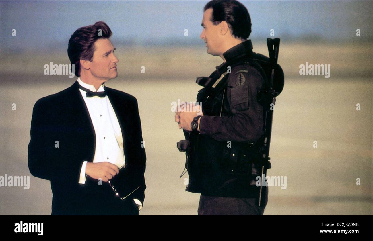 Kurt Russell & Steven Seagal Film: Executive Decision (USA 1996) Characters: Dr. David Grant & Lt. Colonel Austin Travis  Director: Stuart Baird 15 March 1996   **WARNING** This Photograph is for editorial use only and is the copyright of WARNER BROS. and/or the Photographer assigned by the Film or Production Company and can only be reproduced by publications in conjunction with the promotion of the above Film. A Mandatory Credit To WARNER BROS. is required. The Photographer should also be credited when known. No commercial use can be granted without written authority from the Film Company. Stock Photo