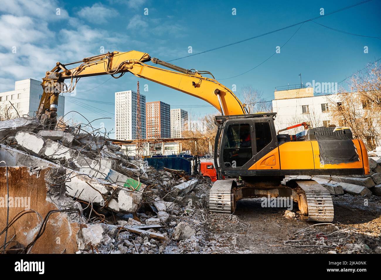 Hydraulic concrete crusher breaks and crushes reinforced concrete Stock