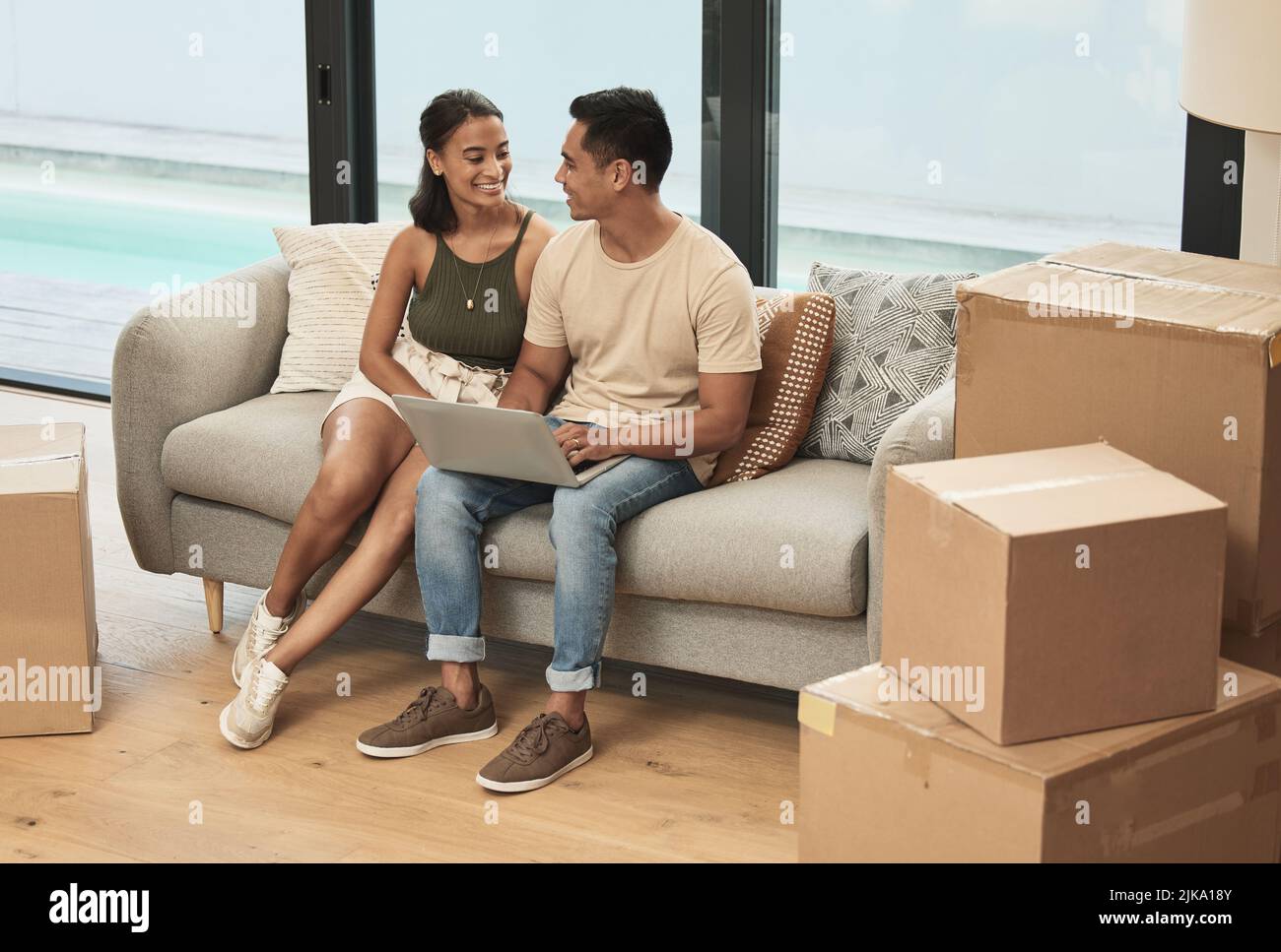 After you love it, you simply call it home. a couple using a laptop at ...
