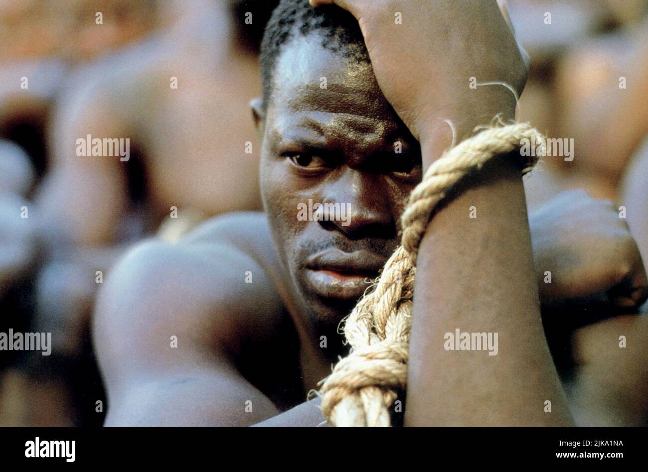 Djimon Hounsou Film: Amistad (USA 1997) Characters: Cinque  / Titel Auch: 'Amistad – Das Sklavenschiff' Director: Steven Spielberg 04 December 1997   **WARNING** This Photograph is for editorial use only and is the copyright of DREAMWORKS and/or the Photographer assigned by the Film or Production Company and can only be reproduced by publications in conjunction with the promotion of the above Film. A Mandatory Credit To DREAMWORKS is required. The Photographer should also be credited when known. No commercial use can be granted without written authority from the Film Company. Stock Photo