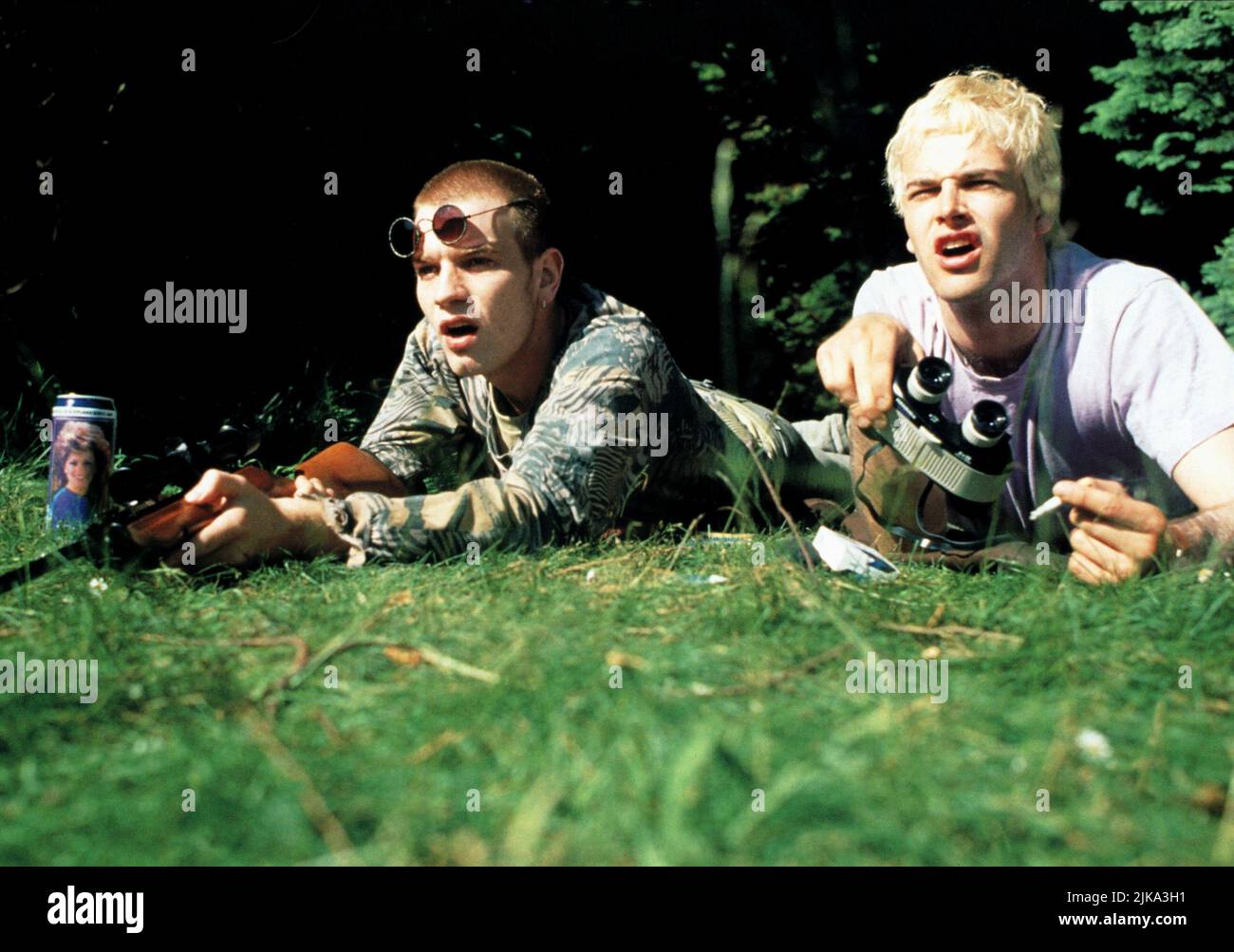 Jonny Lee Miller & Ewan Mcgregor Film: Trainspotting (UK 1996) Characters: Sick Boy & Renton  Director: Danny Boyle 23 February 1996   **WARNING** This Photograph is for editorial use only and is the copyright of CHANNEL FOUR FILMS and/or the Photographer assigned by the Film or Production Company and can only be reproduced by publications in conjunction with the promotion of the above Film. A Mandatory Credit To CHANNEL FOUR FILMS is required. The Photographer should also be credited when known. No commercial use can be granted without written authority from the Film Company. Stock Photo